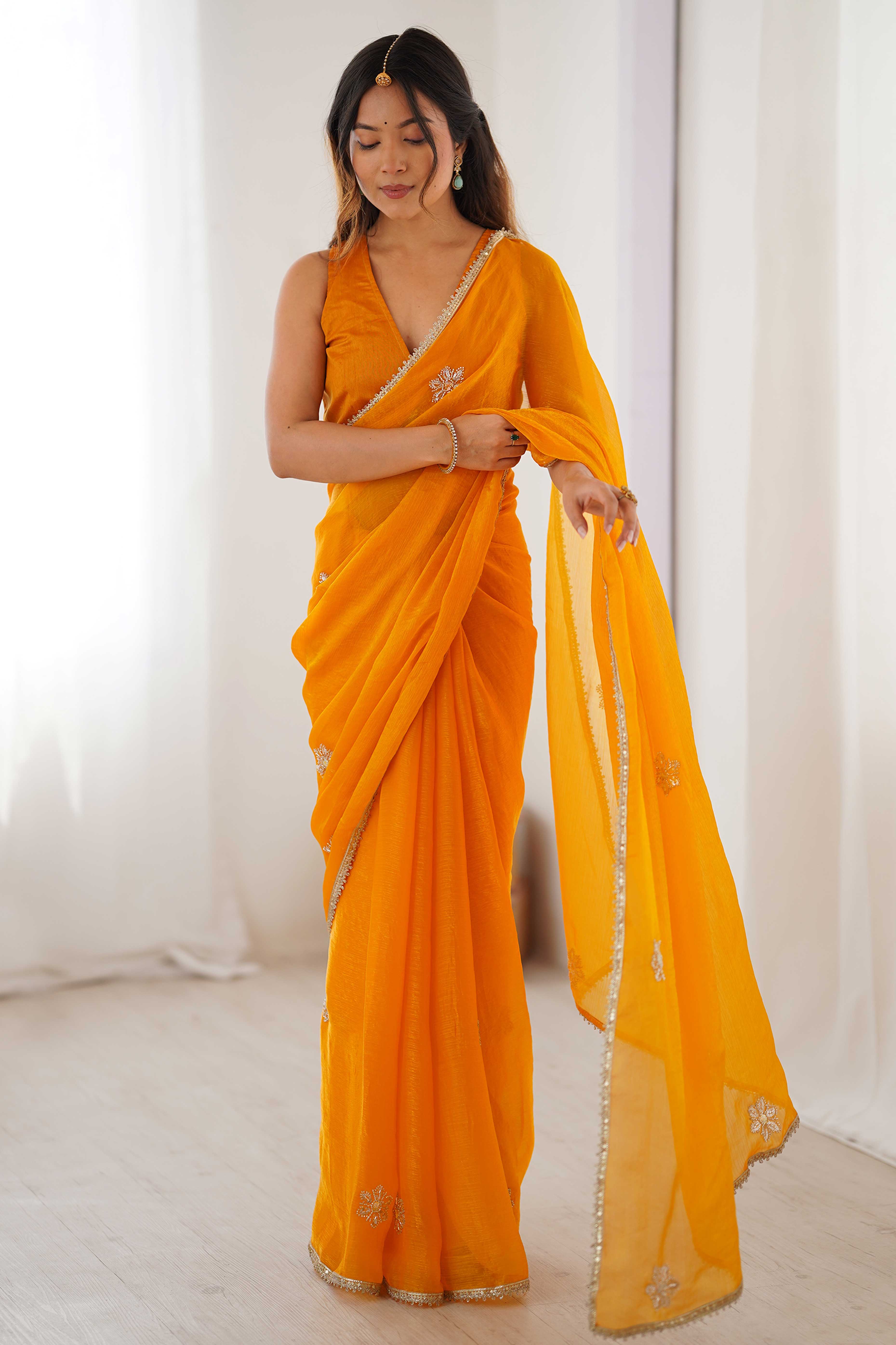 Mustard Yellow Organza Saree Embellished with Intricate Floral Work and Elegant Lace Detailing