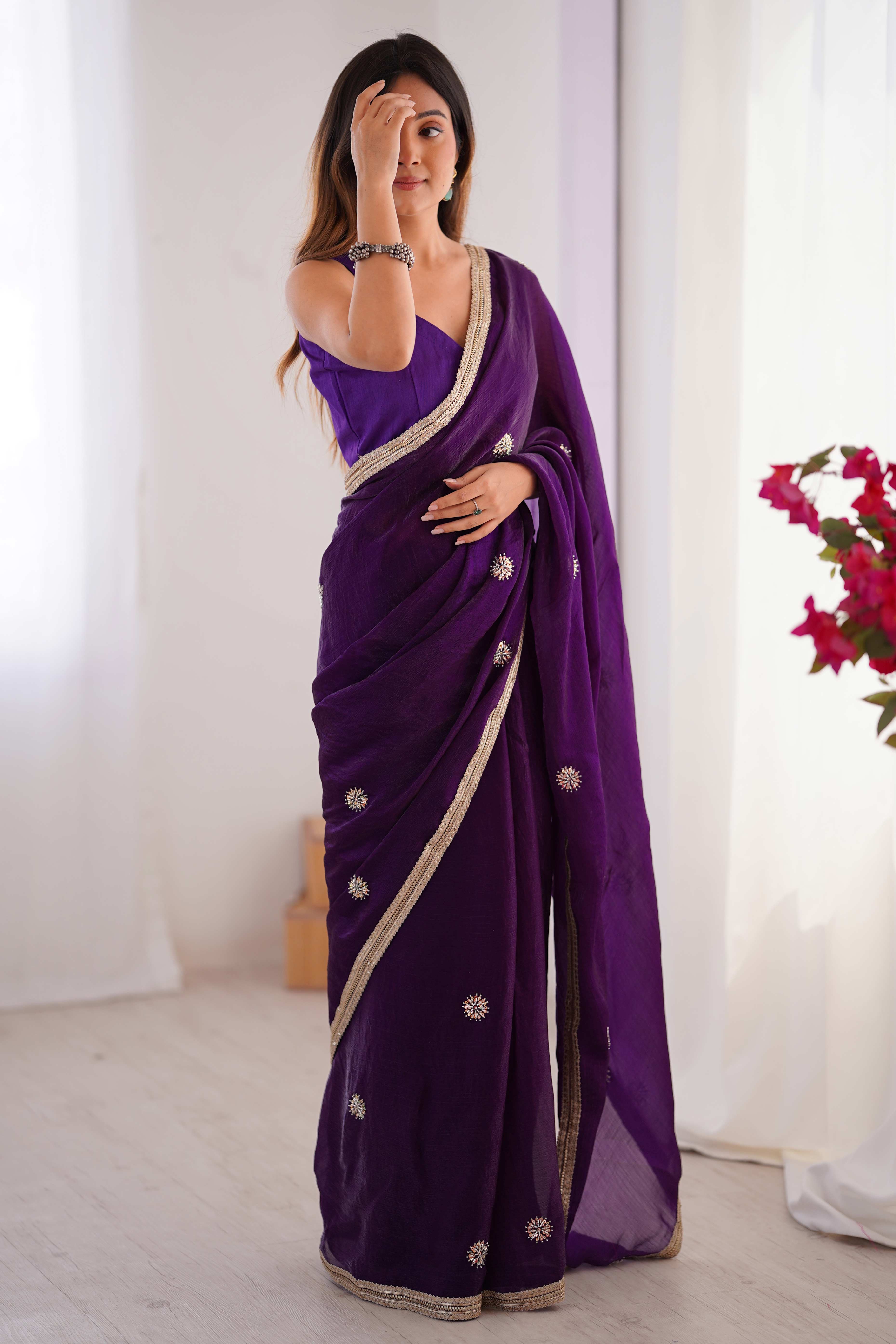 Elegant Deep Purple Organza Saree with Delicate Floral Embellishments and Lace Border