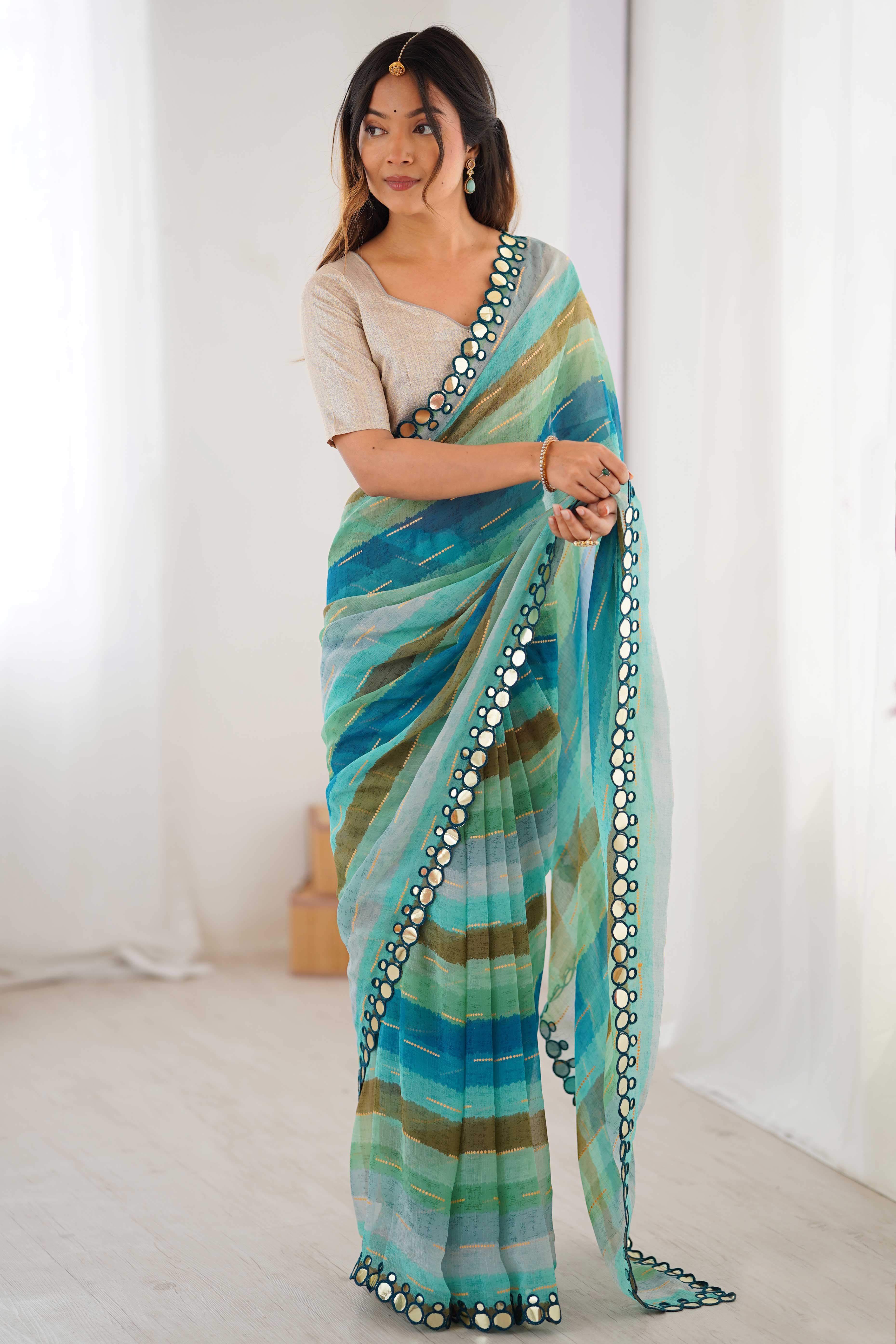 Soft Chiffon Turquoise Saree Featuring Classic Leheriya and Mirror Work Edges