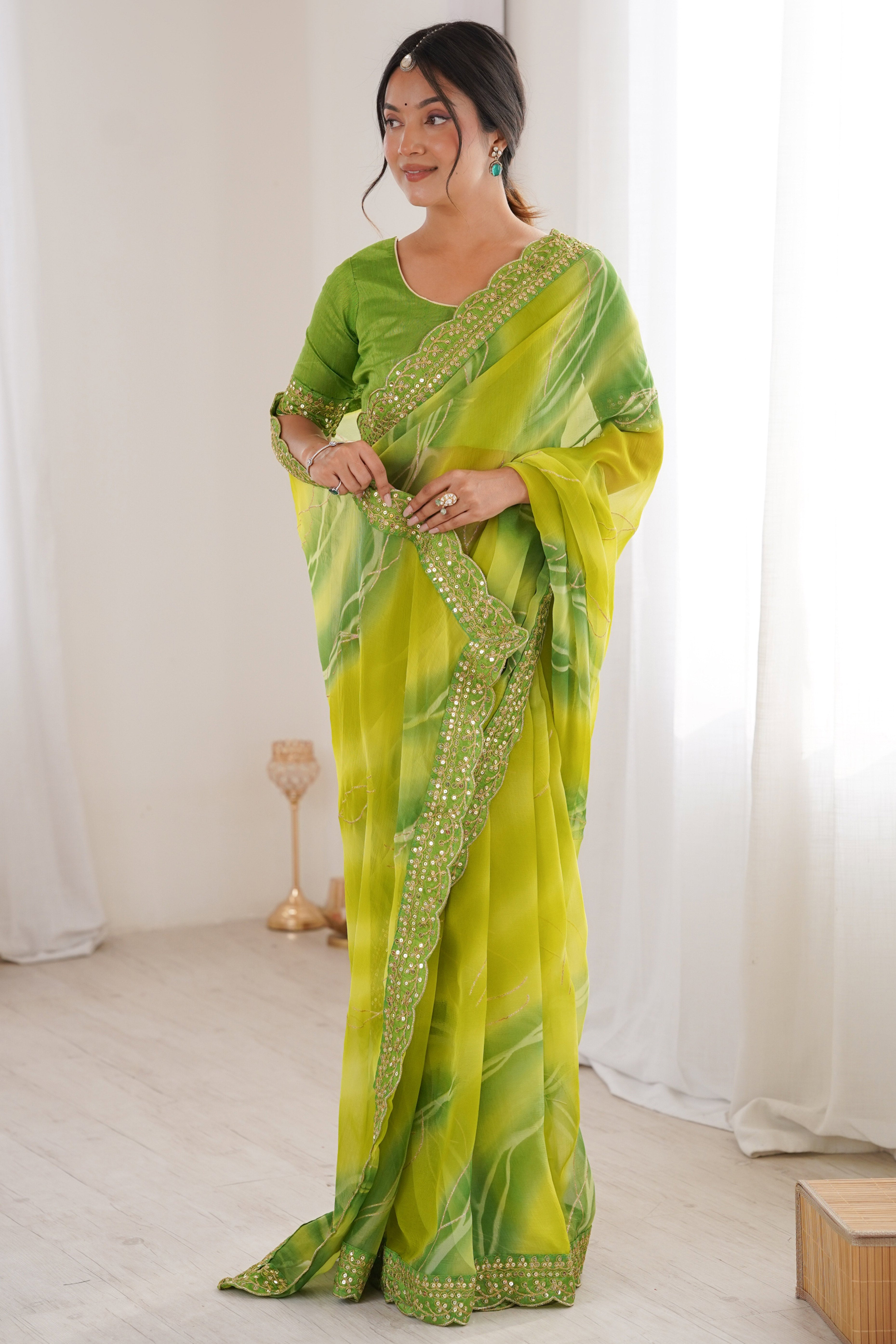 Graceful Green Foil Print Georgette Saree Featuring A Luxurious Cording Sequins Embroidered Border