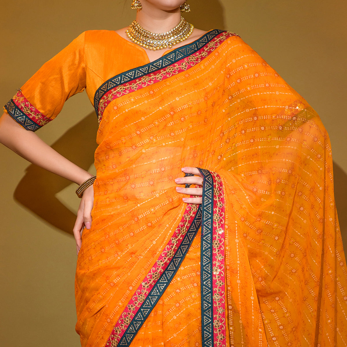 Orange Foil Printed Georgette Saree With Embroidered Border