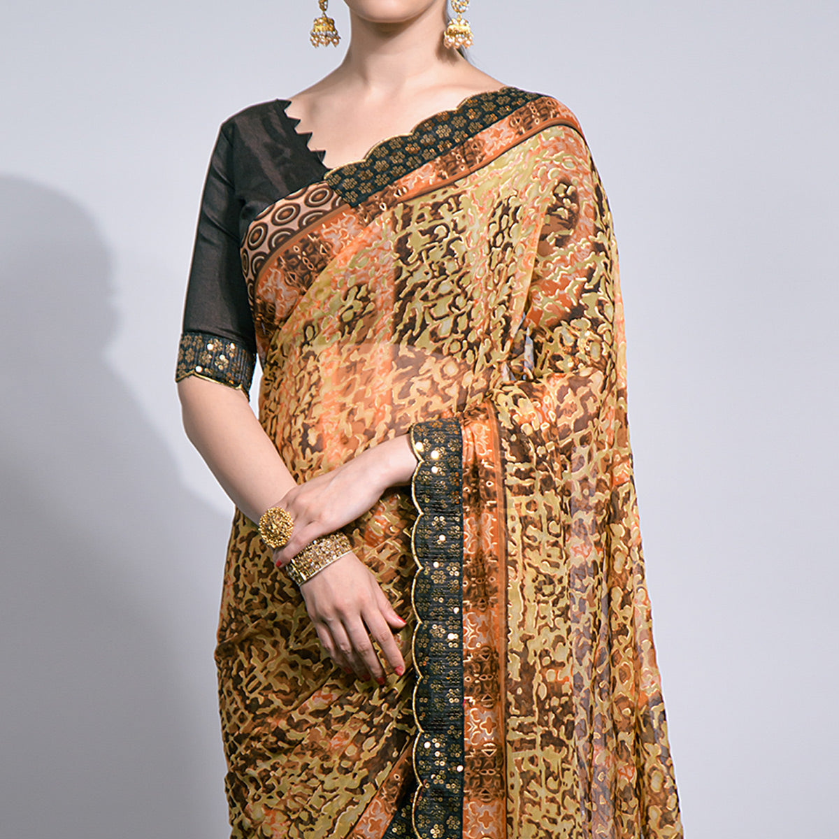 Brown Foil Printed Chiffon Saree With Embroidered Border