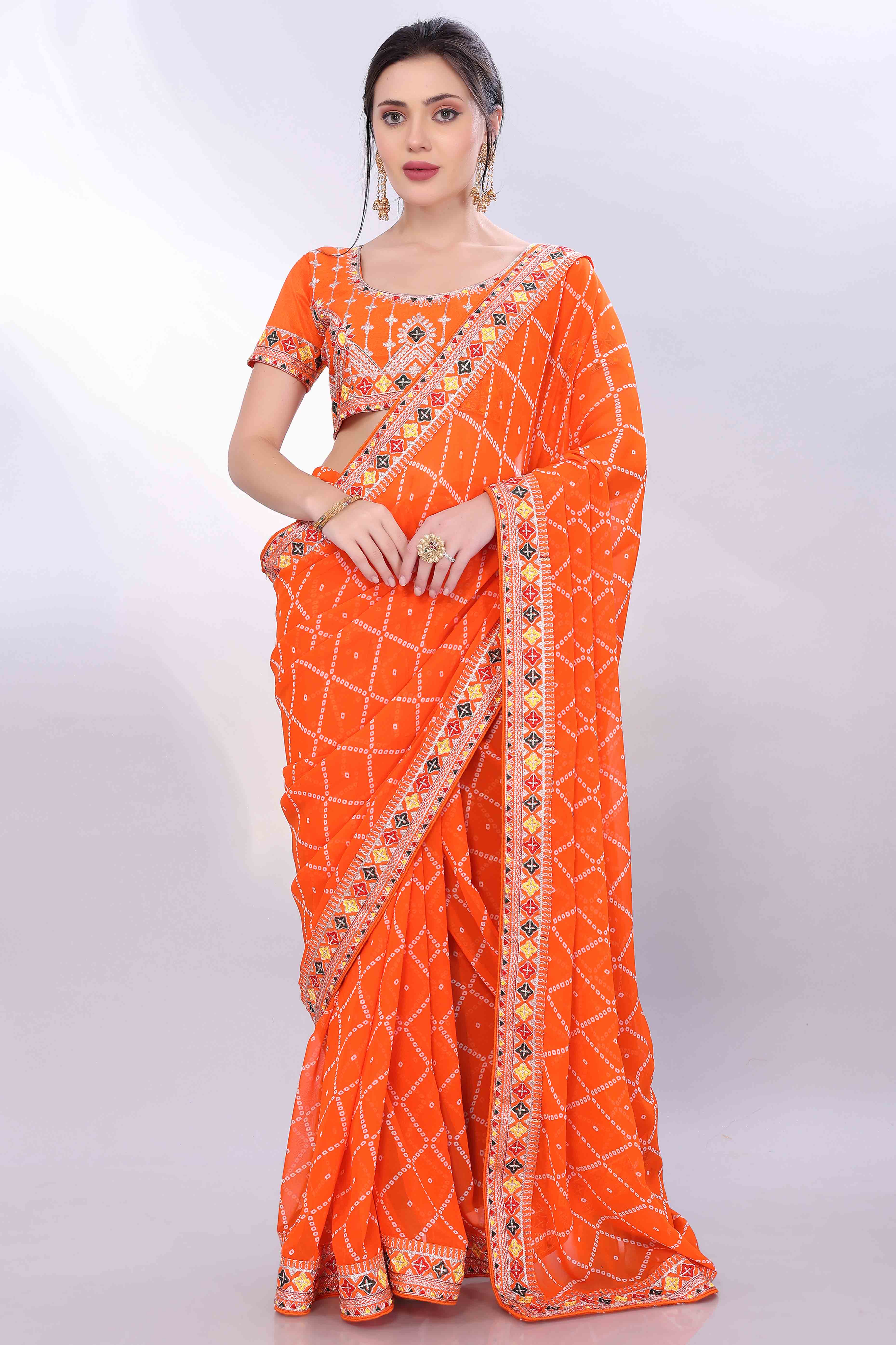 Orange Bandhani Printed Georgette Saree Framed With Elegant Embroidered Border