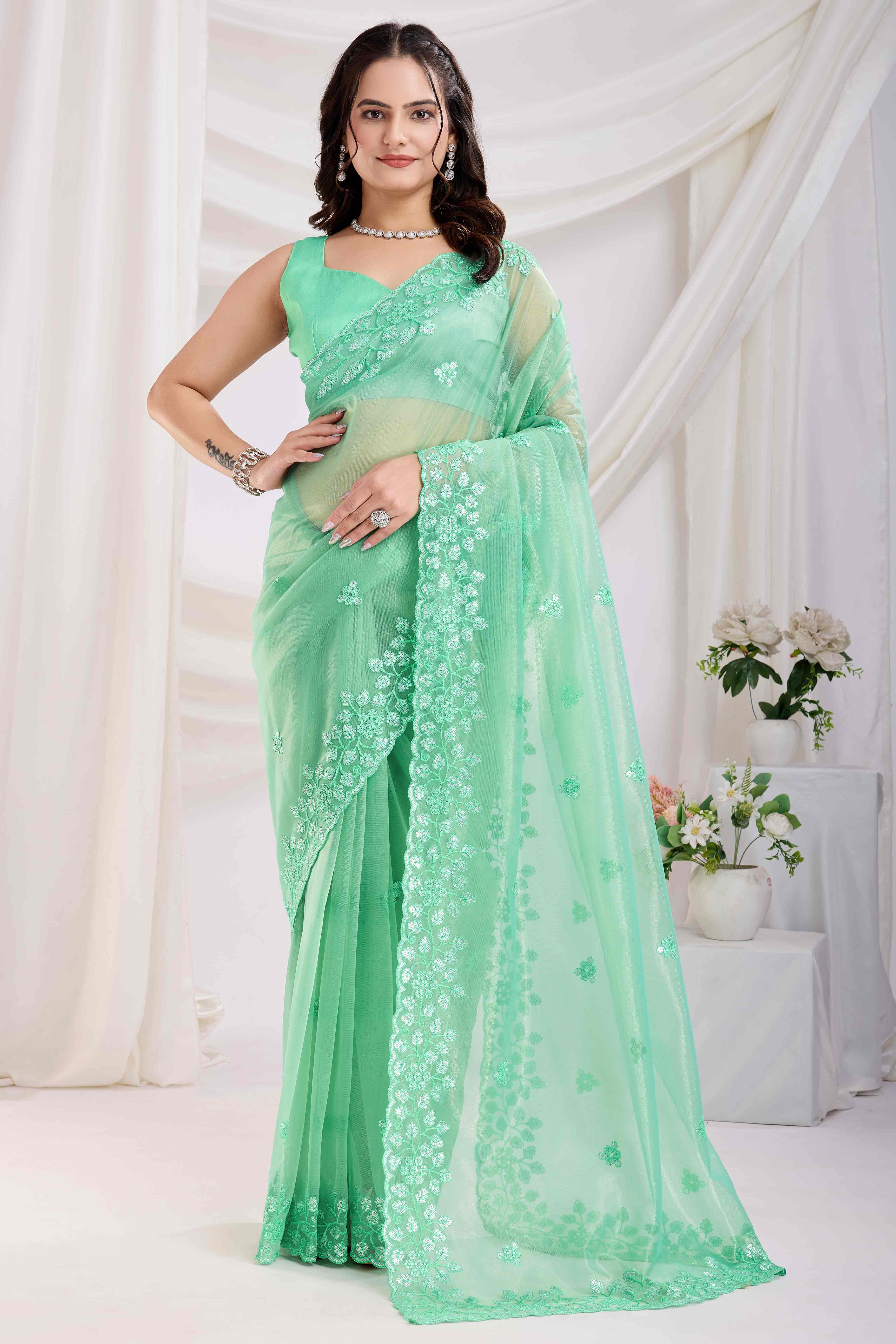 Sea Green Floral Sequins Embroidered Twill Net Saree