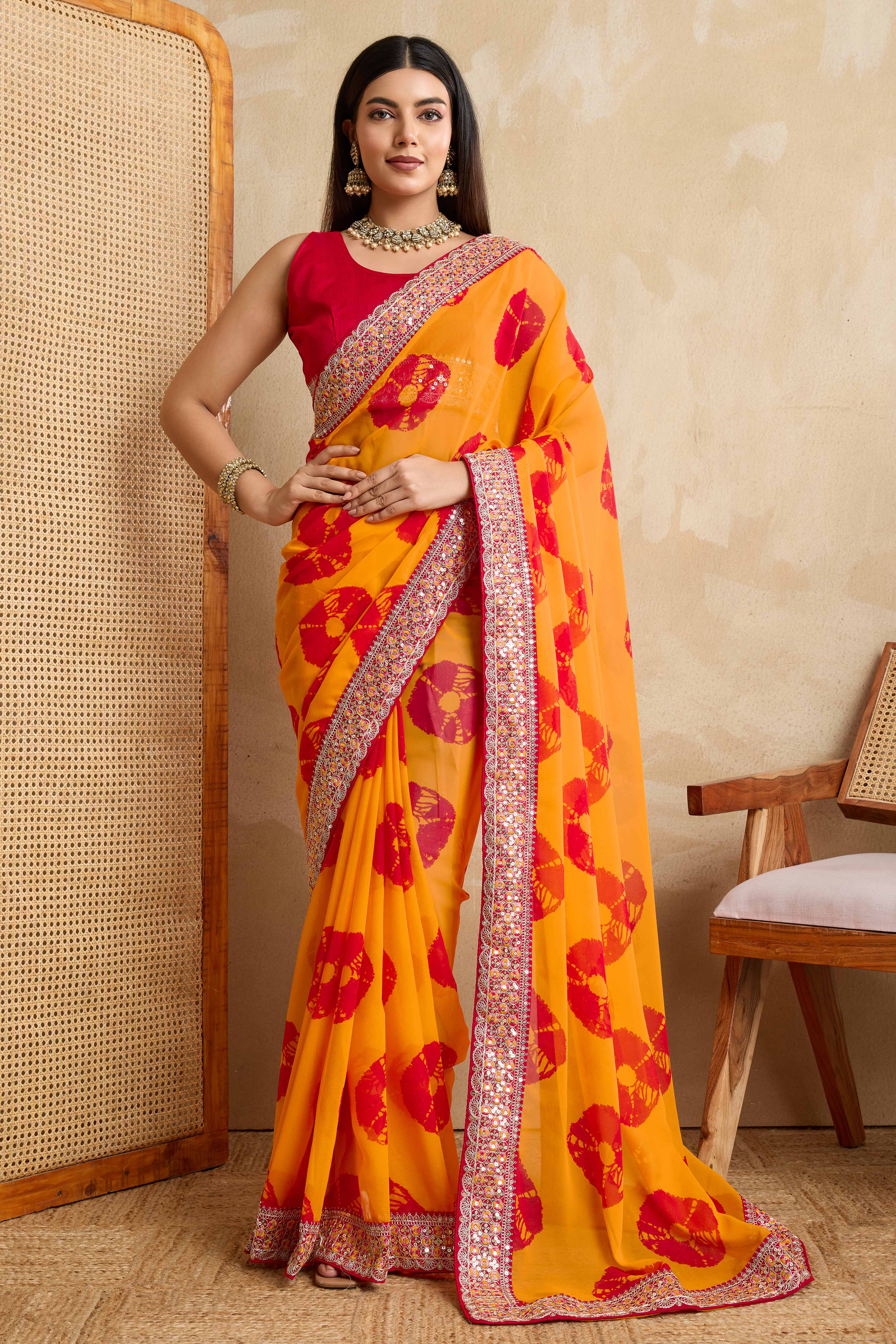 Bright Orange Georgette Saree with Contemporary Tie-Dye Patterns and Classic Lace Work Finish