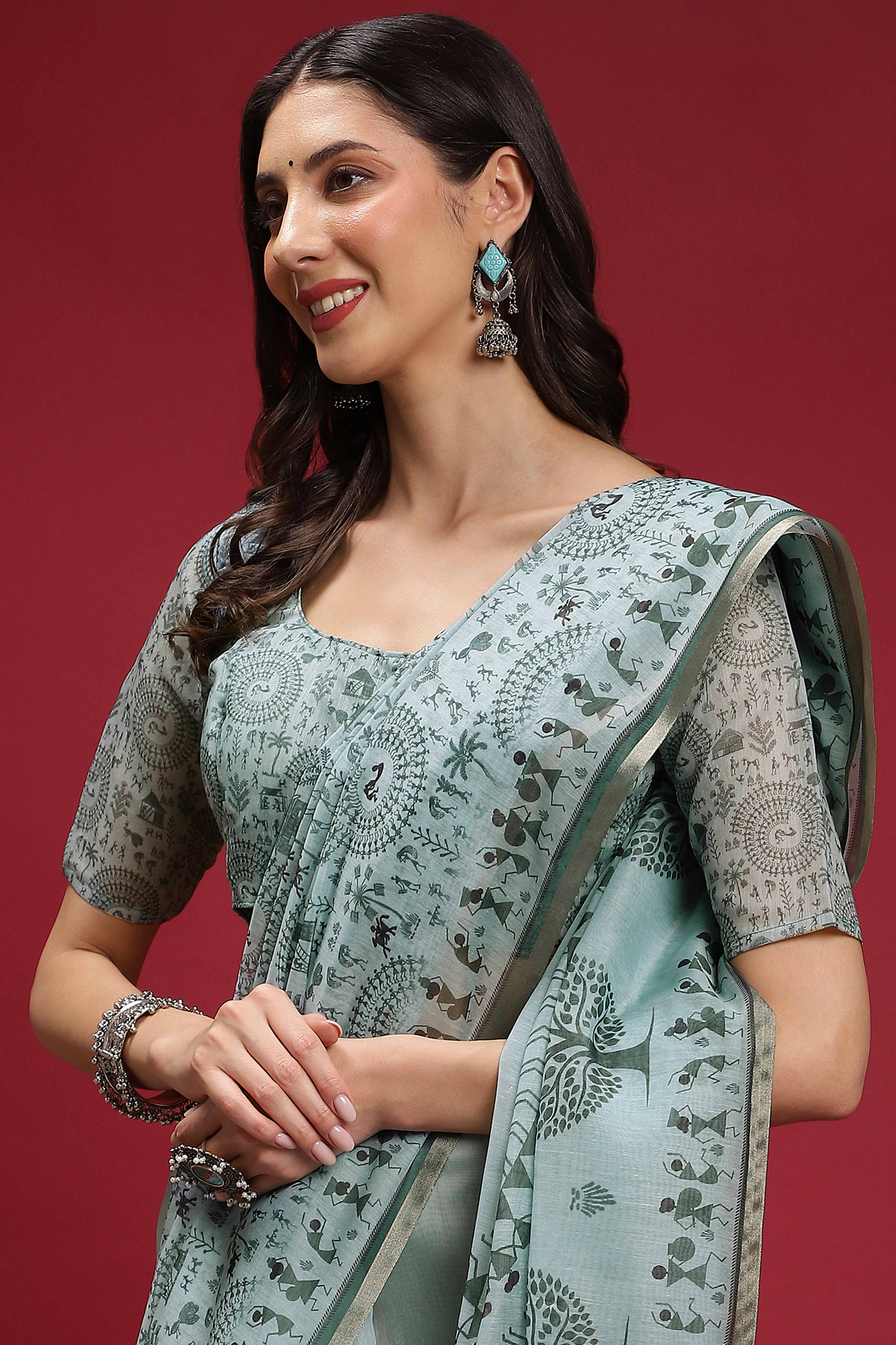 Pastel Blue Linen Cotton Saree Featuring Traditional Warli Prints & Tassel Pallu