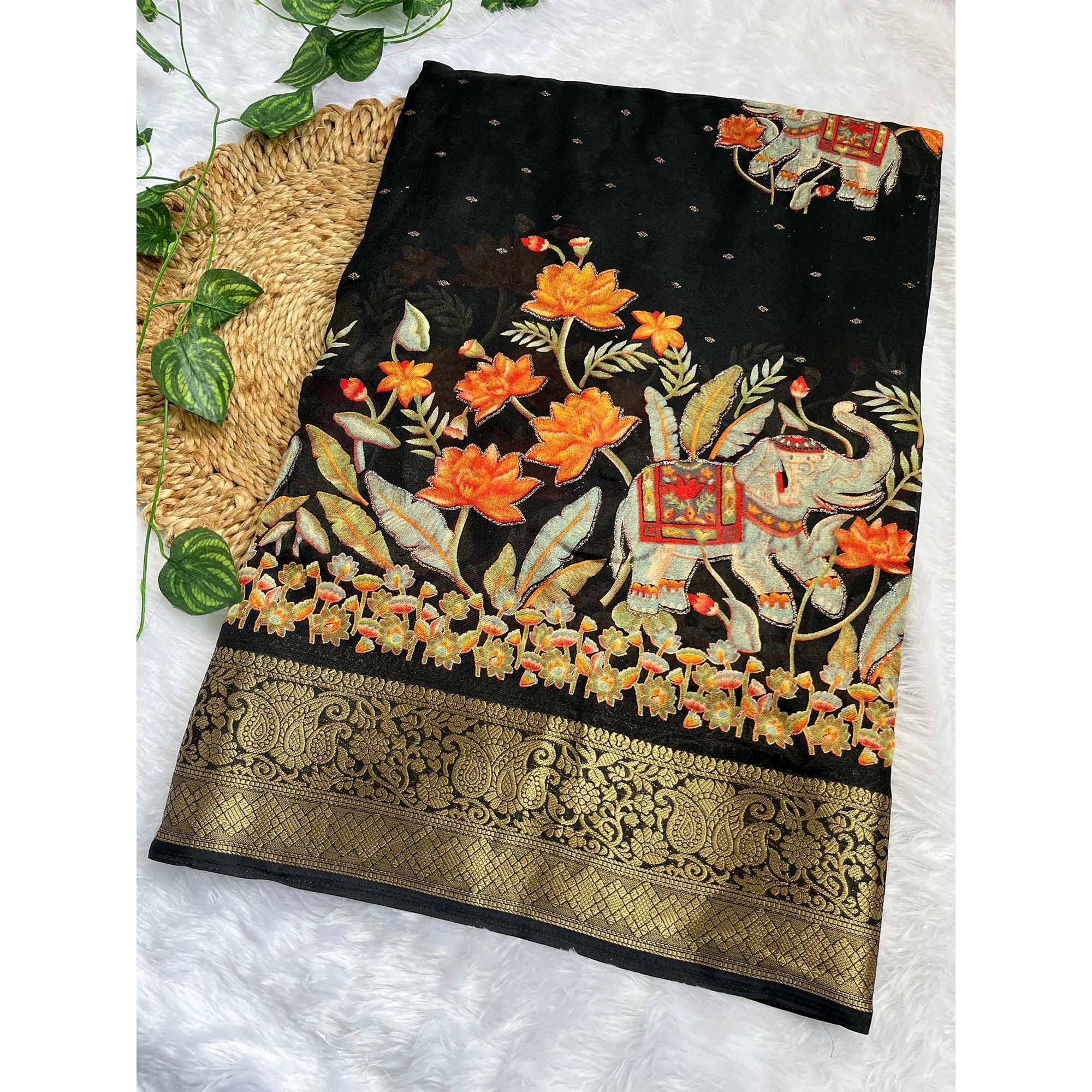 Elegant Black Elephant & Floral Printed Georgette Saree Accented With Gleaming Weaving Zari Border