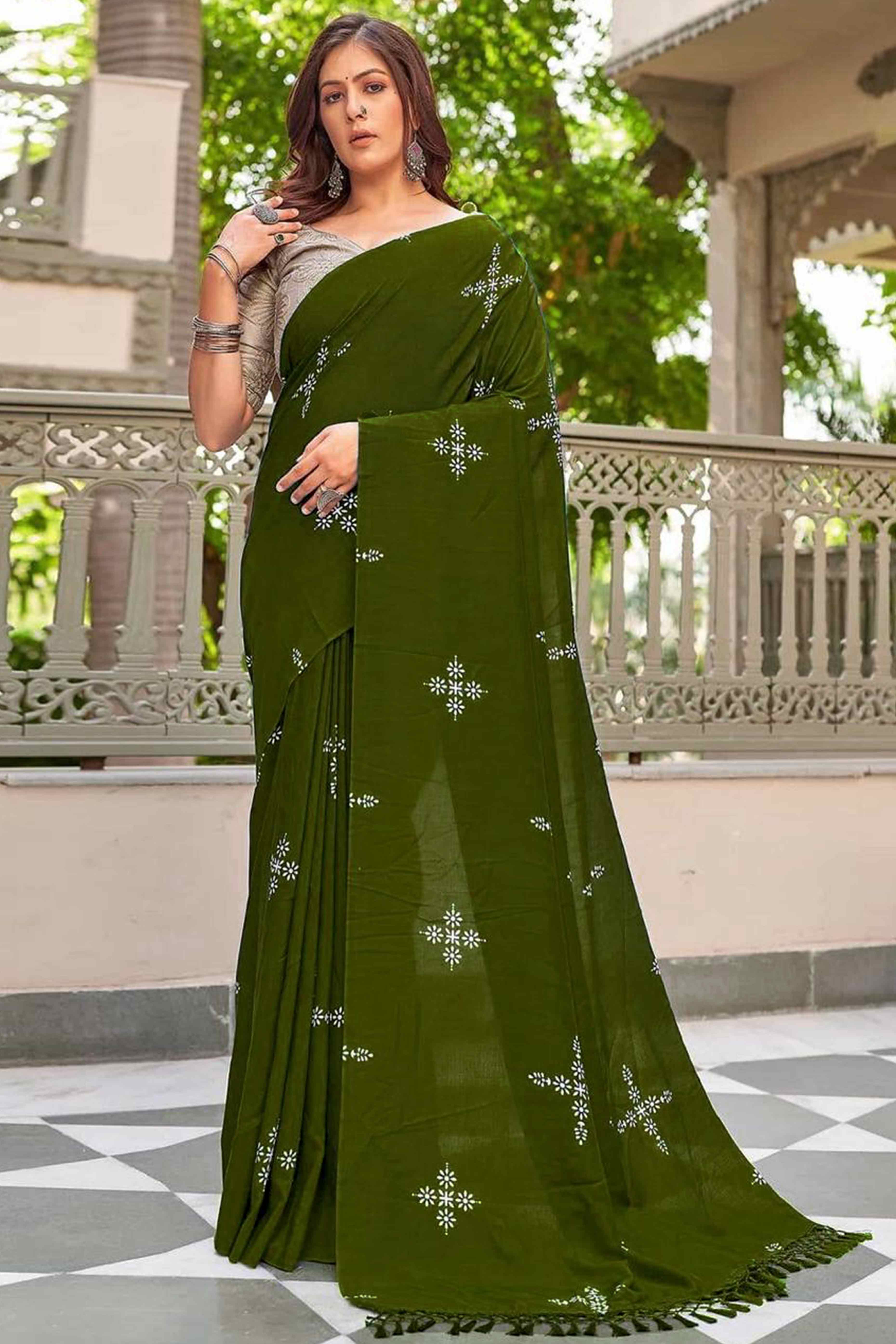 Mehendi Green Muslin Cotton Silk Saree Adorned With Delicate Floral Prints & Playful Tassels