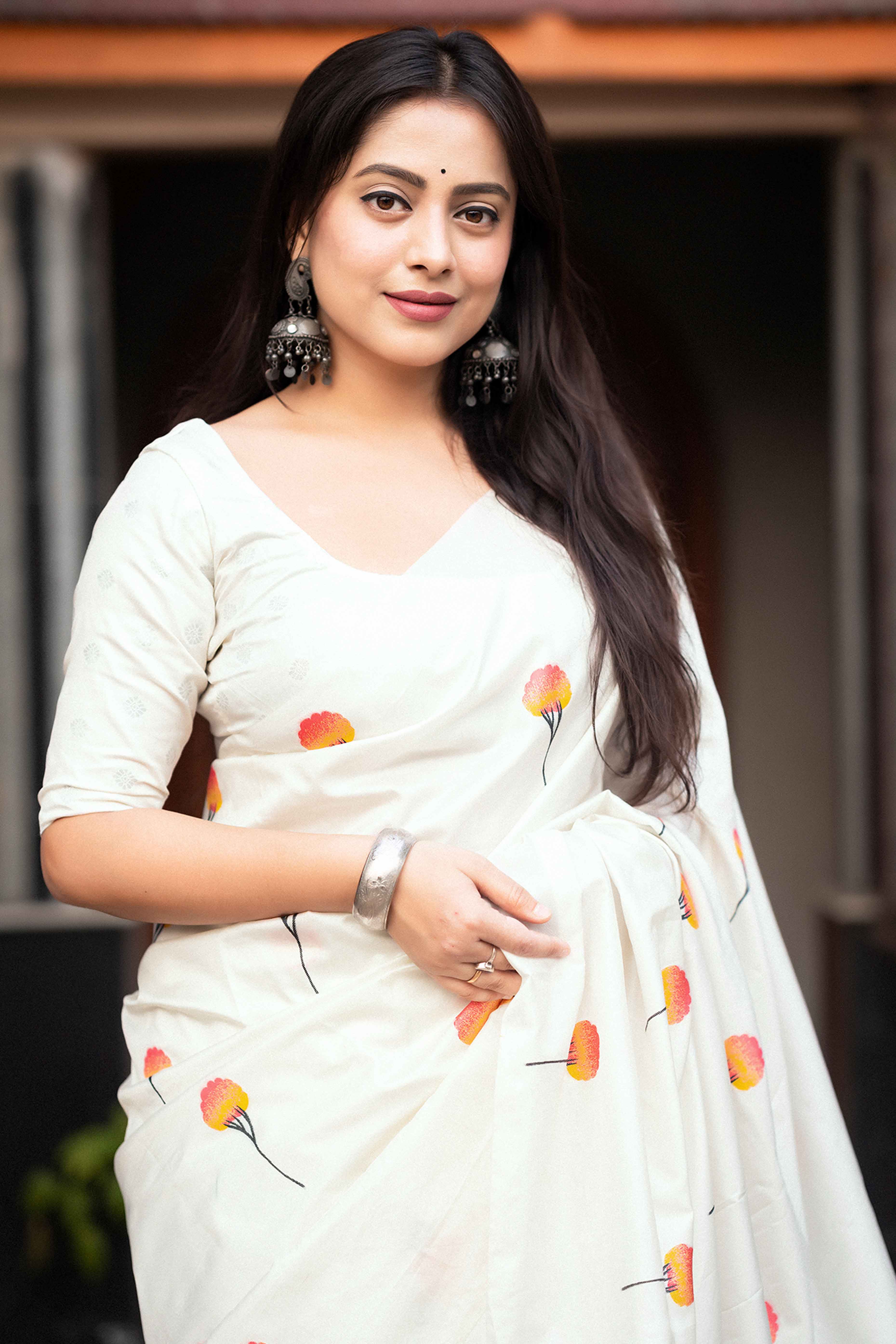 Elegant White Banarasi Silk Saree With Floral Zari Weaving & Tassel Border