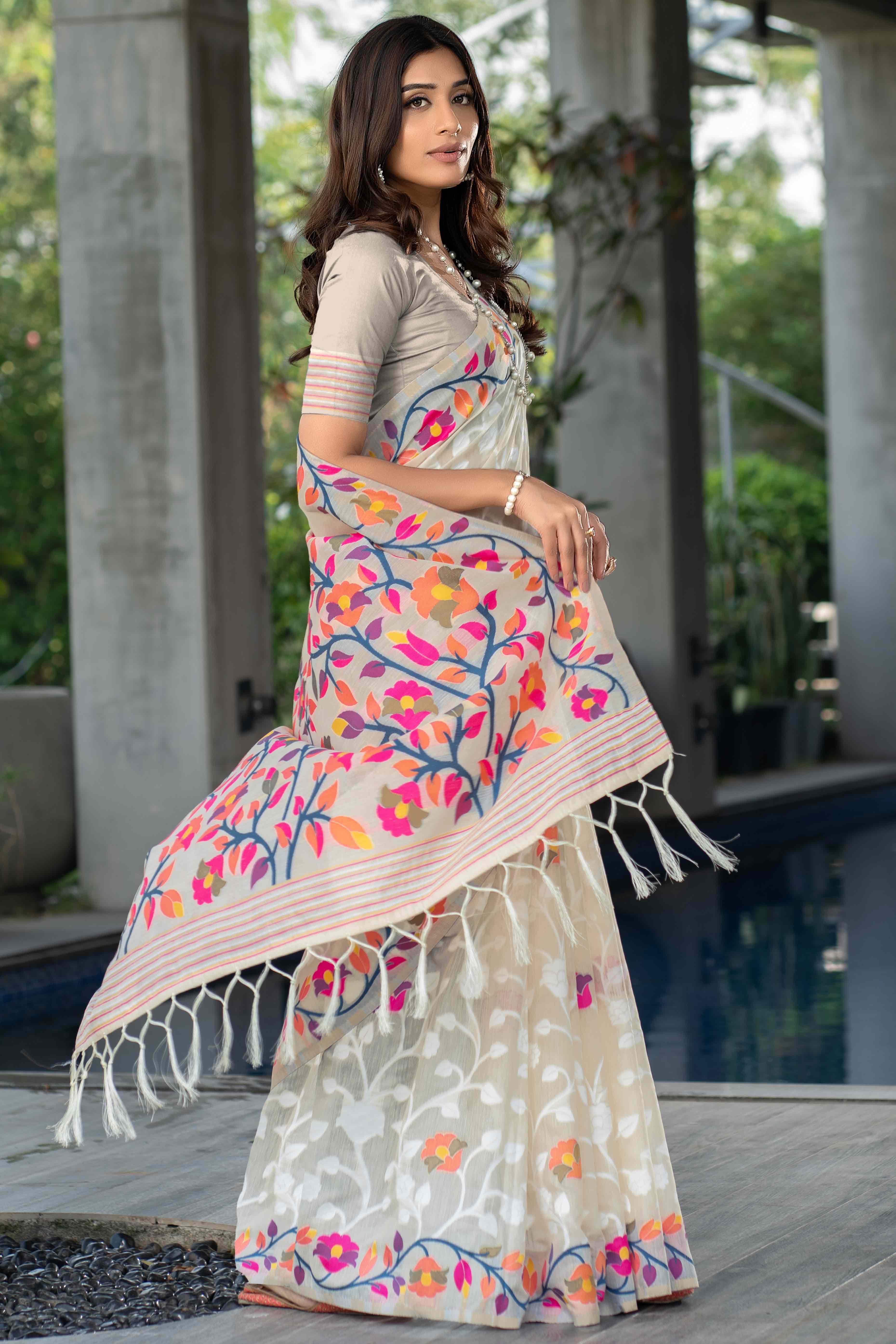 Cream Floral Woven Cotton Jacquard Jamdani Saree With A Graceful Tassel Border