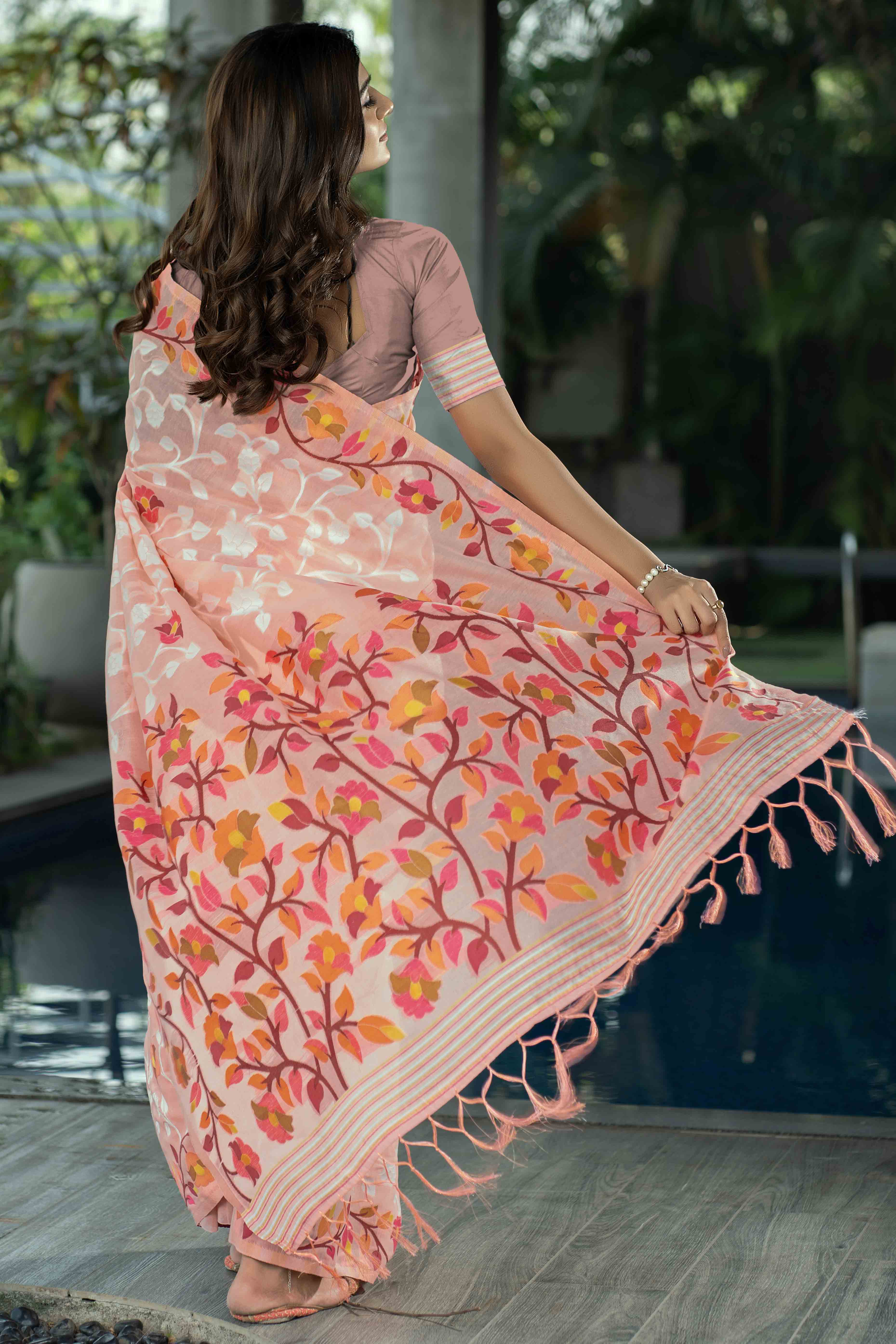 Peach Floral Woven Cotton Jacquard Jamdani Saree With A Graceful Tassel Border