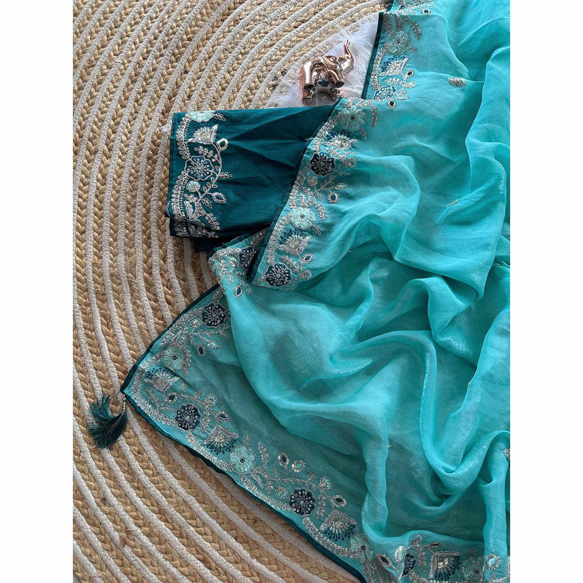 Blue Pure Silk Saree Showcasing Floral Sequins Embroidery With A Decorative Tassel Pallu