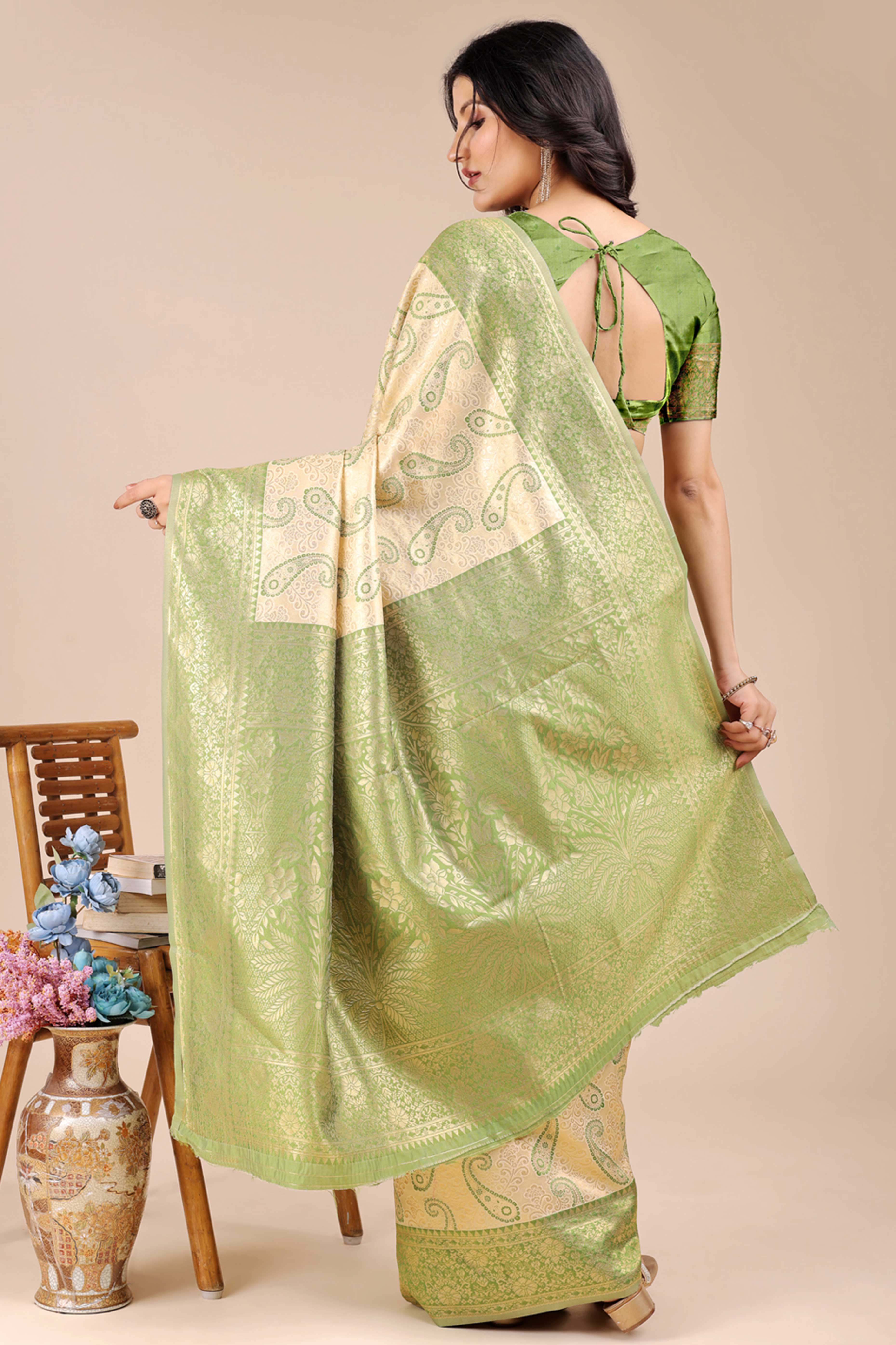 Cream Banarasi Silk Saree Featuring Light Green Floral Zari Weaving and a Rich Contrast Border