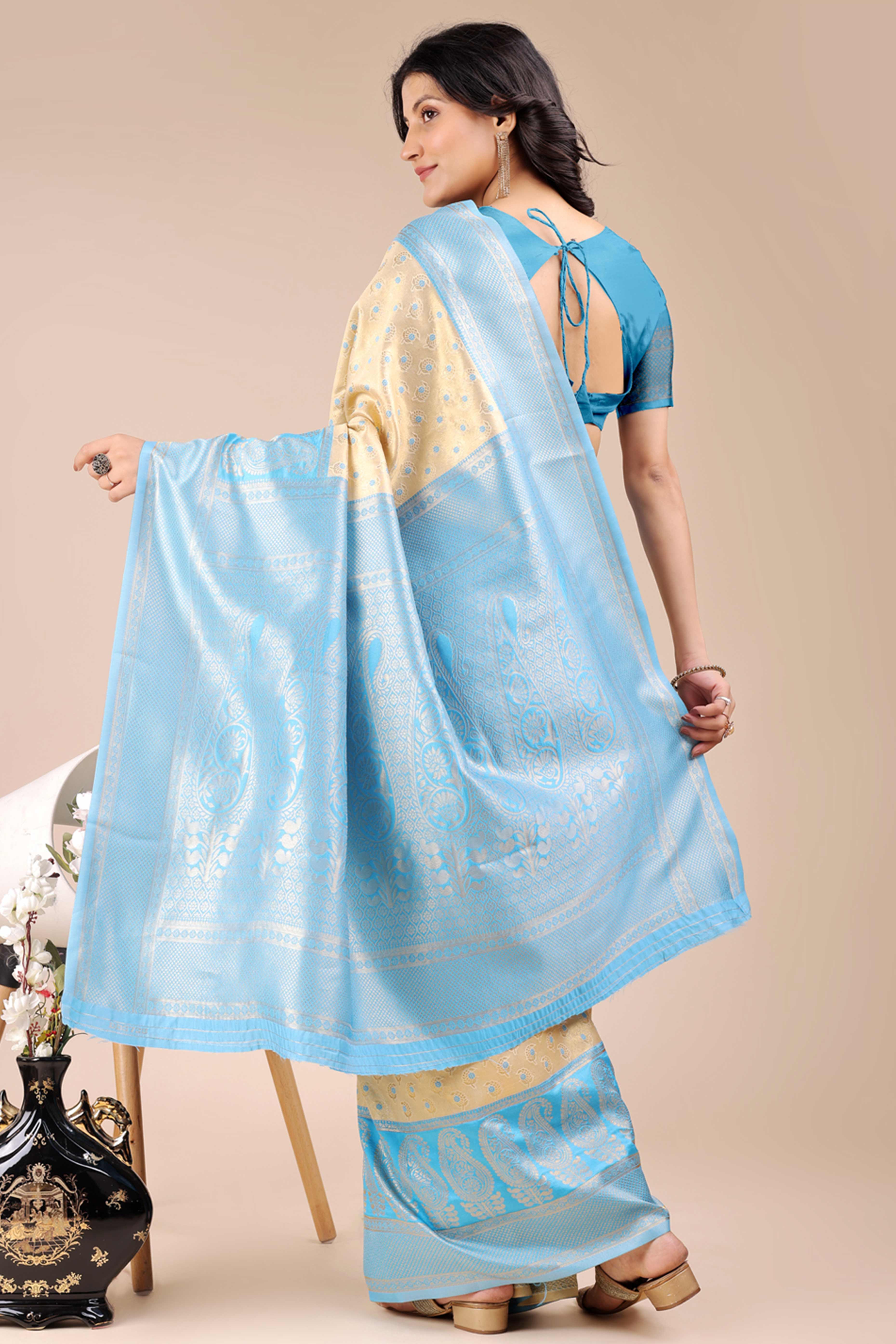 Cream Banarasi Silk Saree Featuring Lustrous Sky Blue Floral Zari Weaving and a Rich Contrast Border