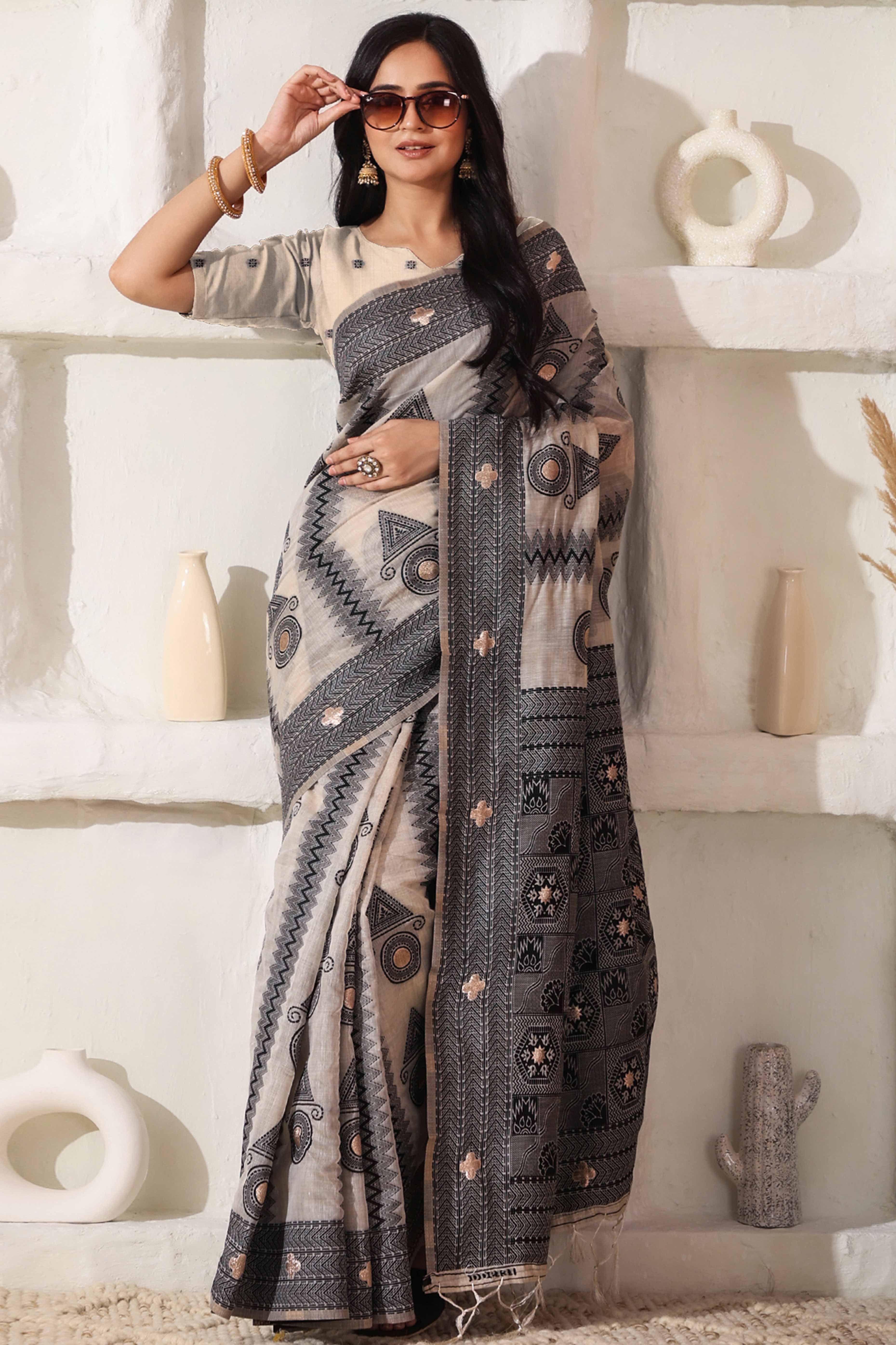 Elegant Zari Weaving Work On Cream & Black Linen Cotton Saree With Tassel Finish