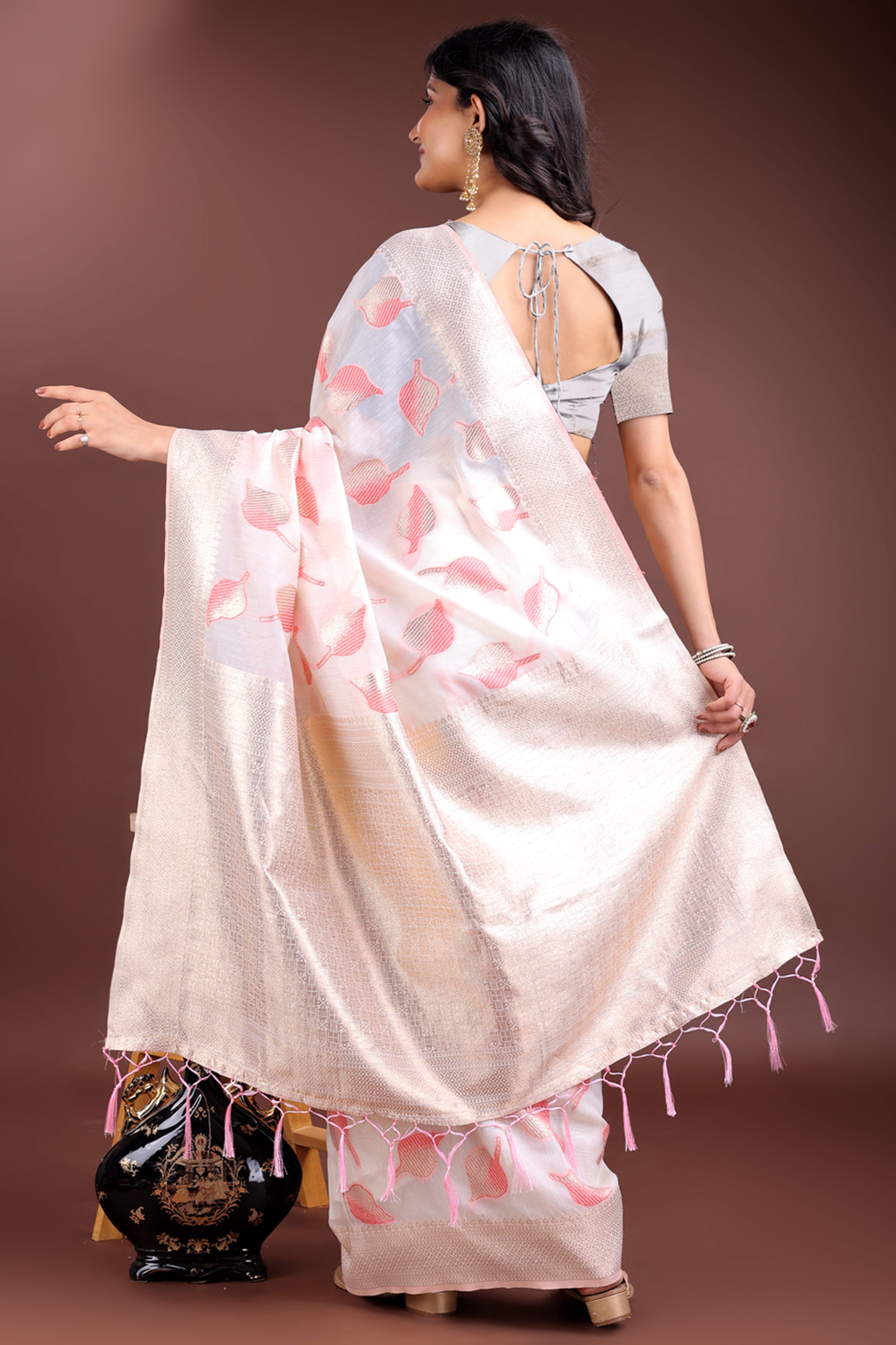 White and Pink Cotton Silk Saree with Leaf Motifs and Zari Border Tassel Design
