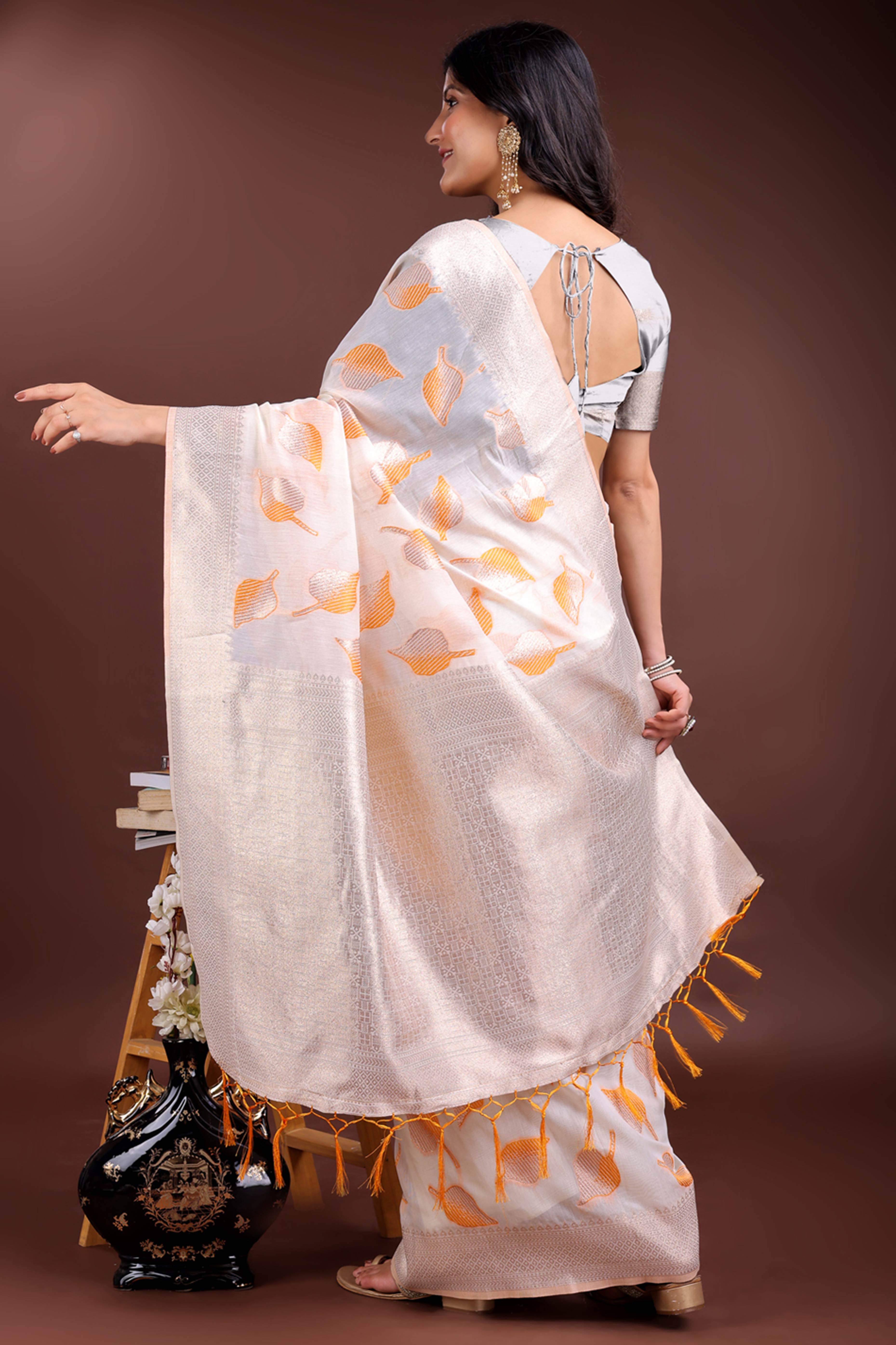 White and Orange Cotton Silk Saree with Leaf Motifs and Zari Border Tassel Style
