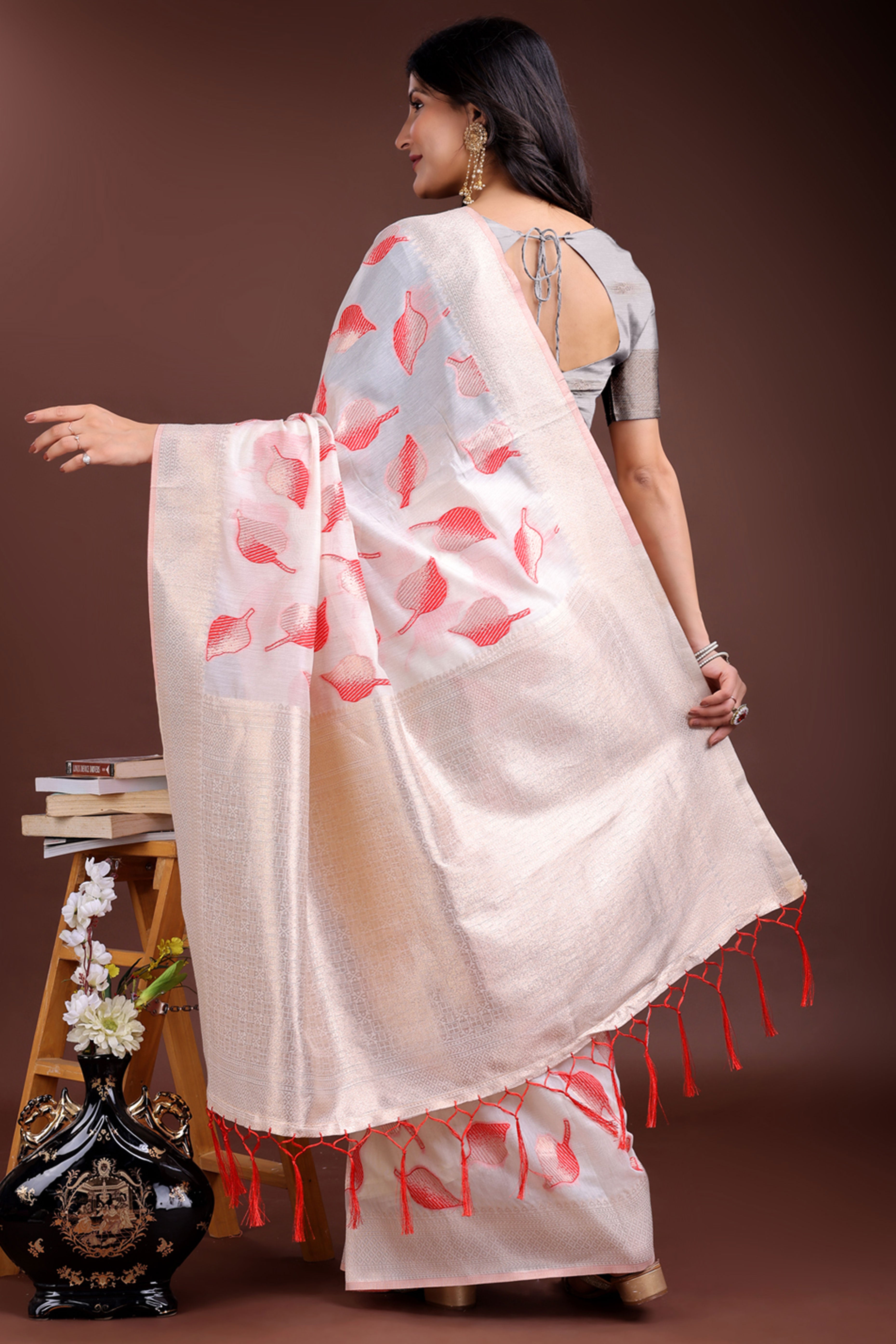 White and Red Cotton Silk Saree with Leaf Motifs and Zari Border Tassel Artistry