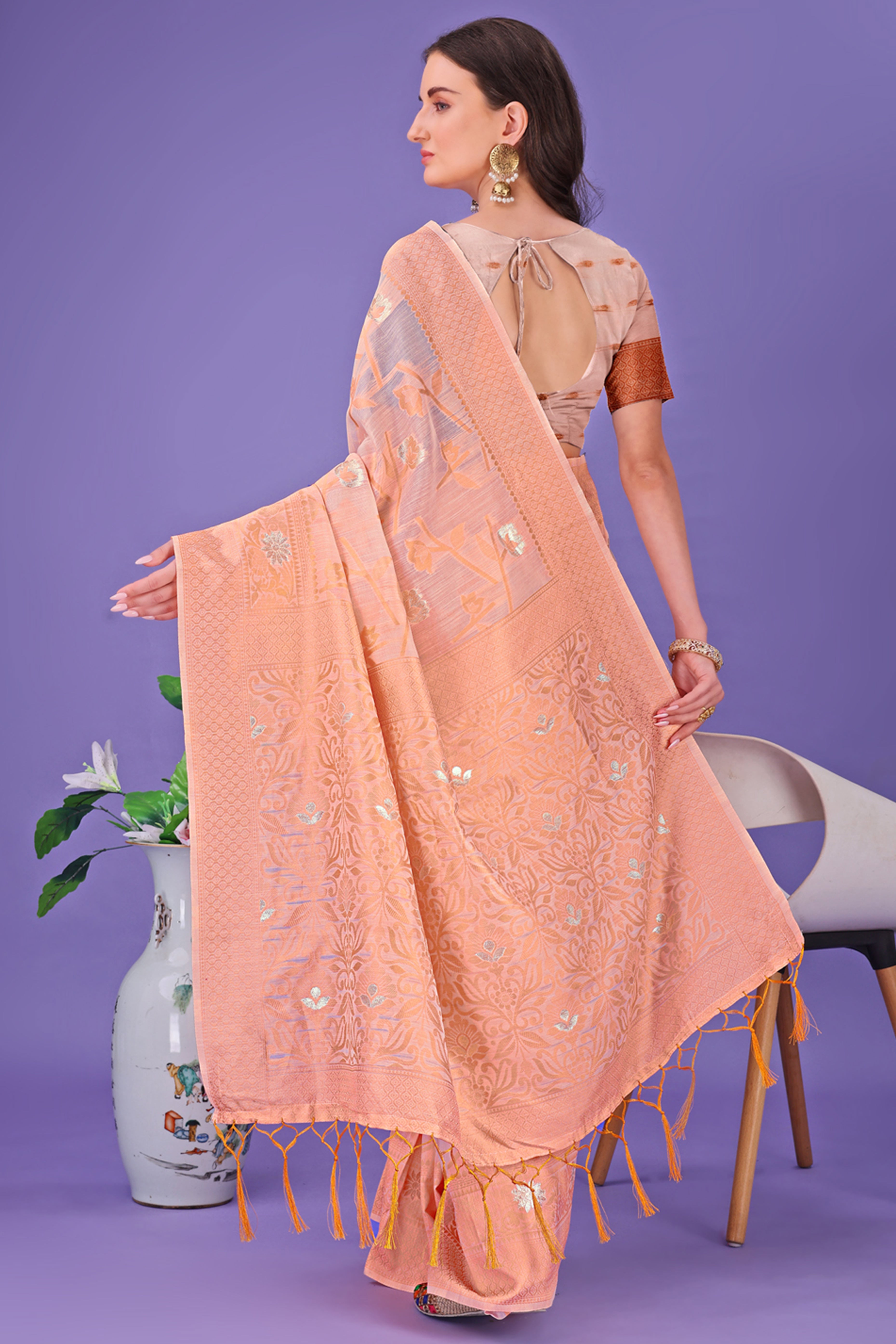 Peach Floral Pattern Woven Saree in a Soft Cotton Blend with Tasseled Edges