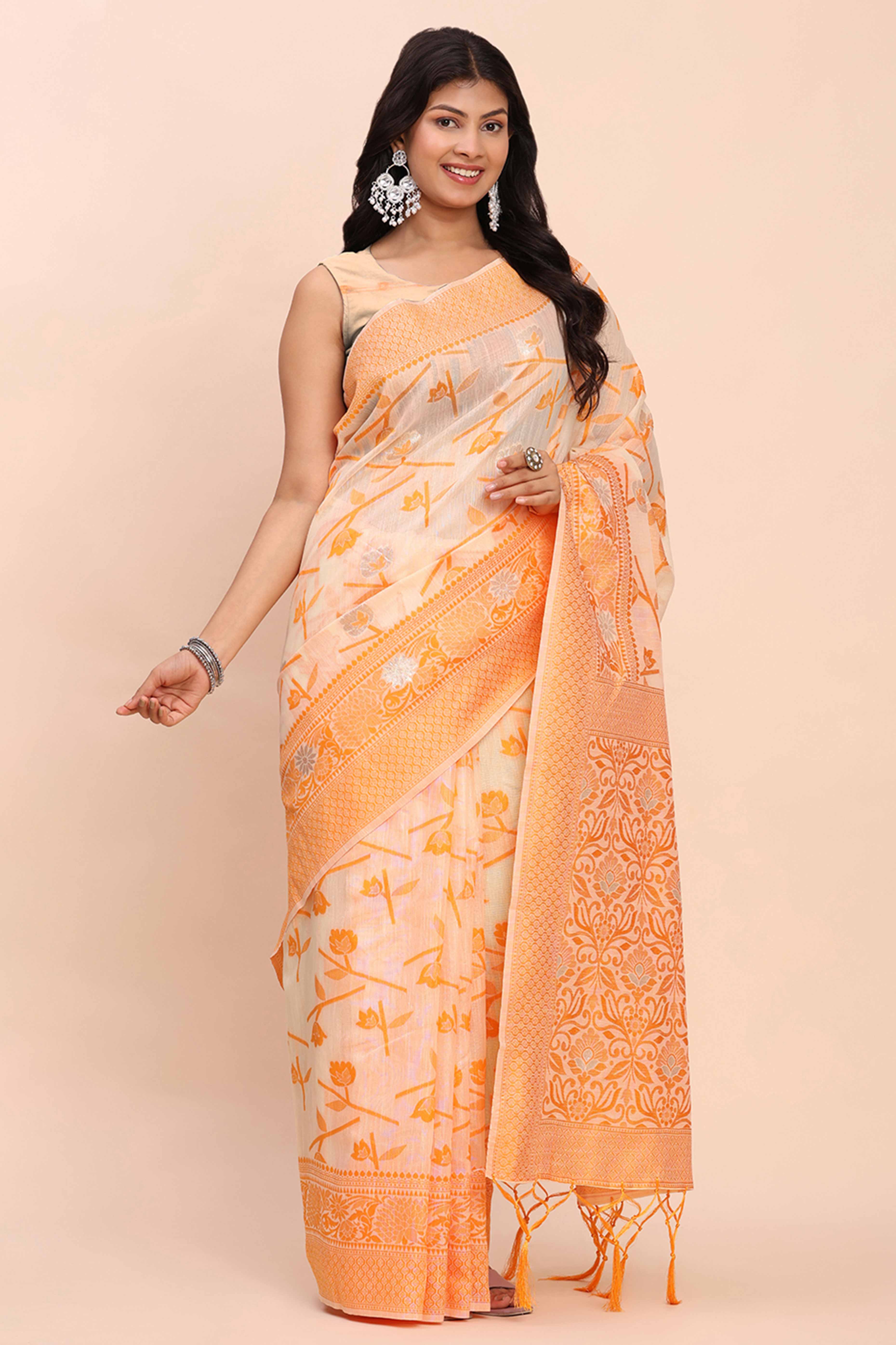 Orange Floral Linen Cotton Saree Accented With Zari Weaving & Tassel Pallu Elegance