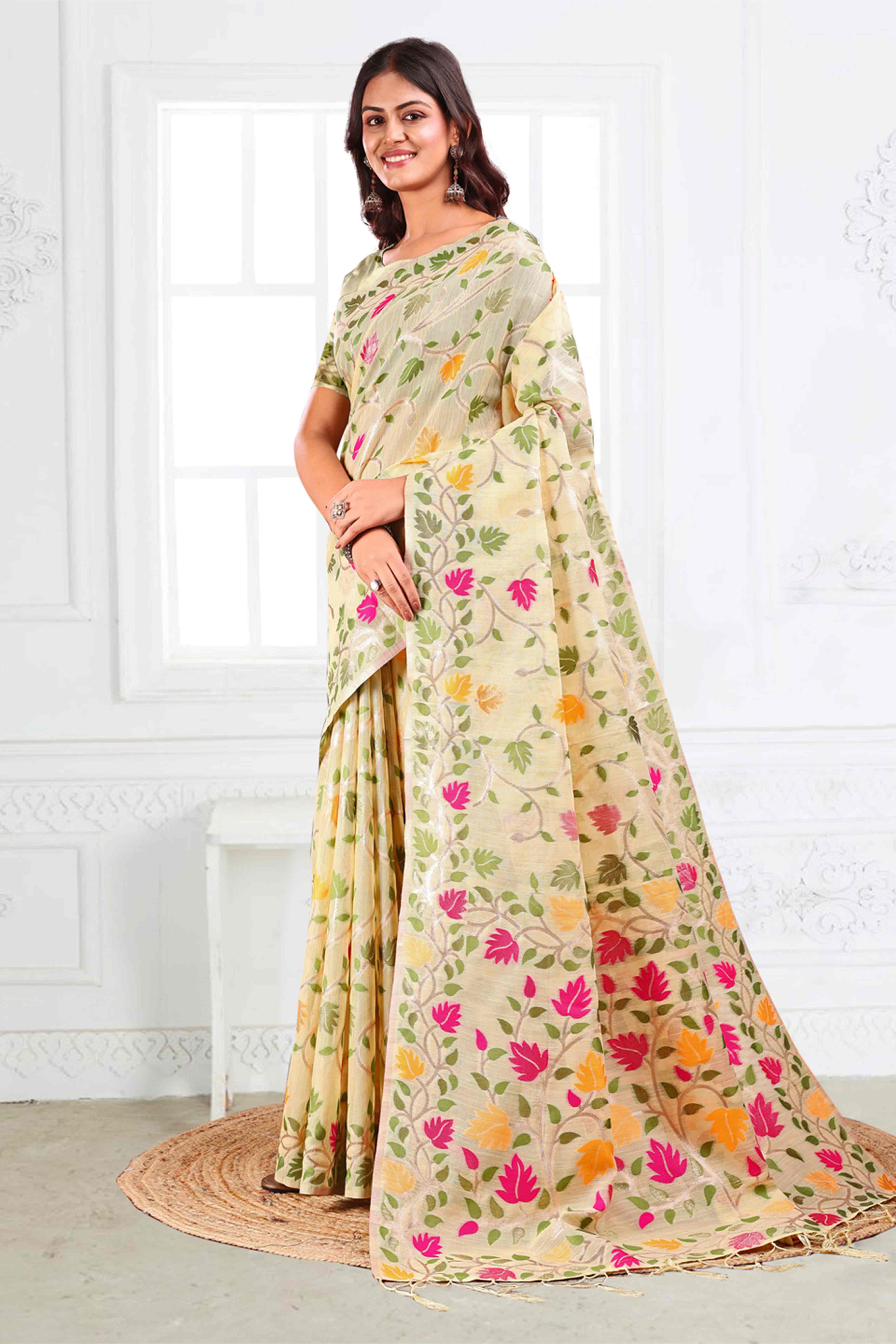 Cream Linen Cotton Silk  Saree Enhanced With Floral Zari Weaving & Tasselled Pallu Finish