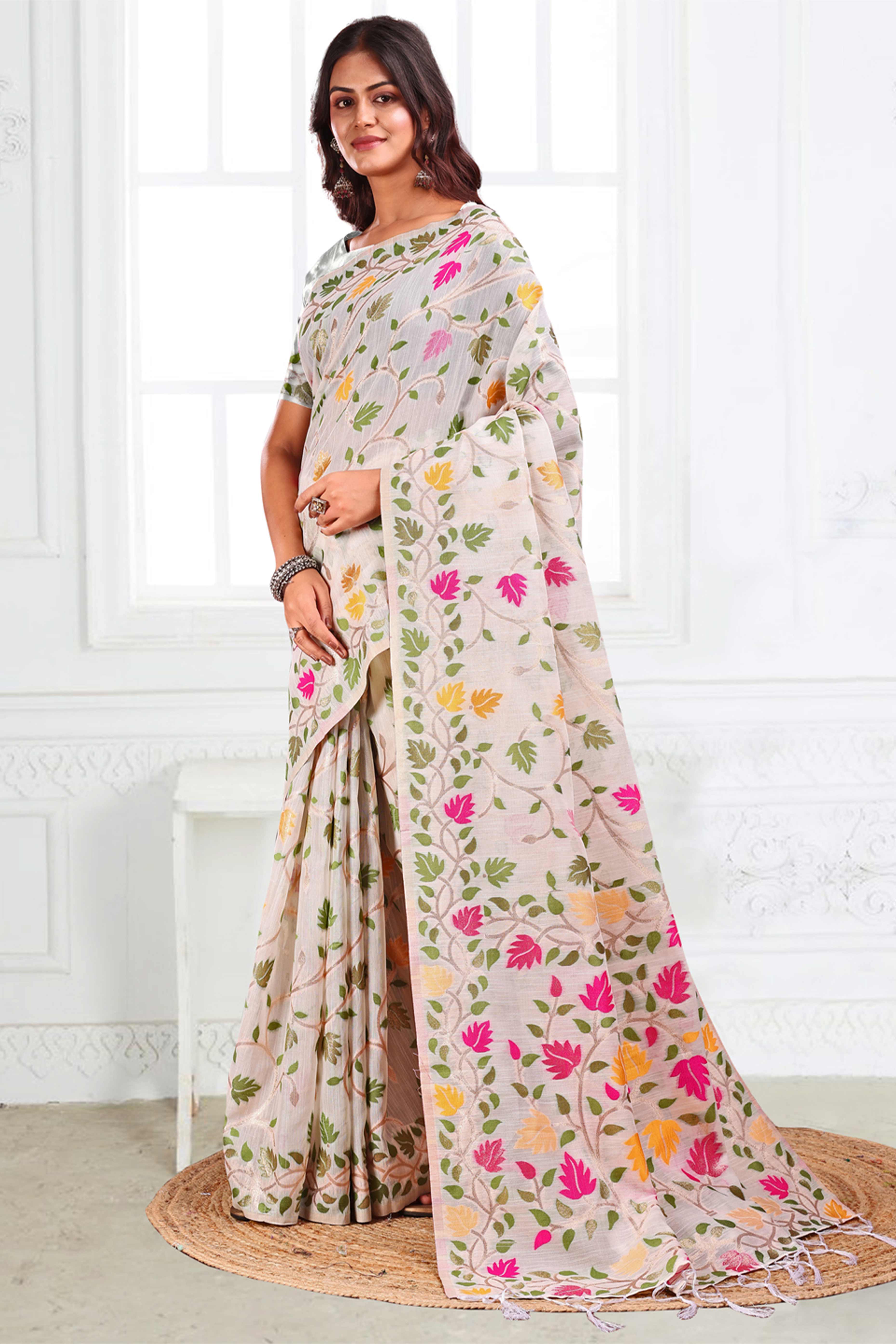 White Linen Cotton Silk  Saree Enhanced With Floral Zari Weaving & Tasselled Pallu Finish