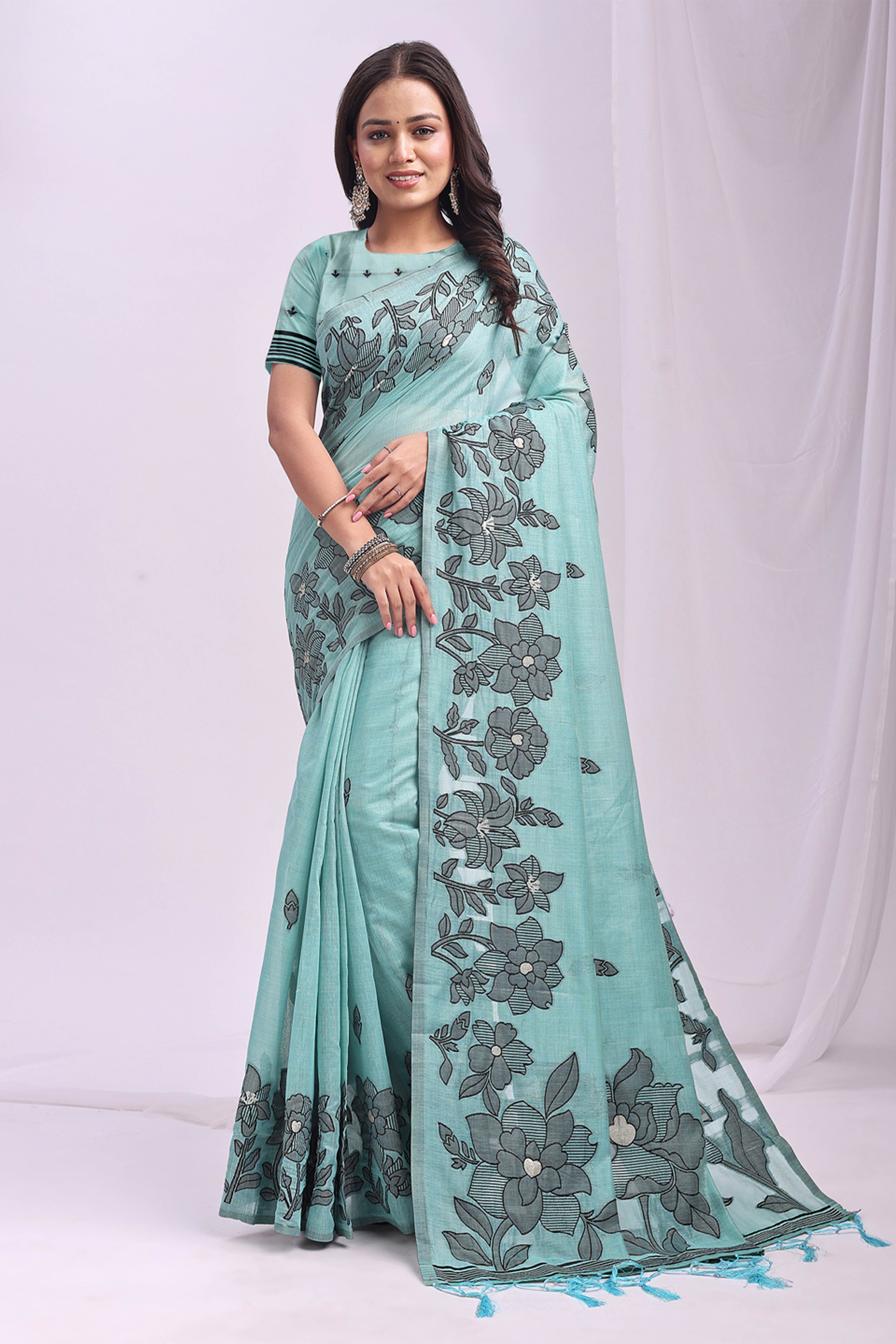Sea Green Ethnic Saree in a Linen Cotton Blend Adorned with Floral Weave Designs