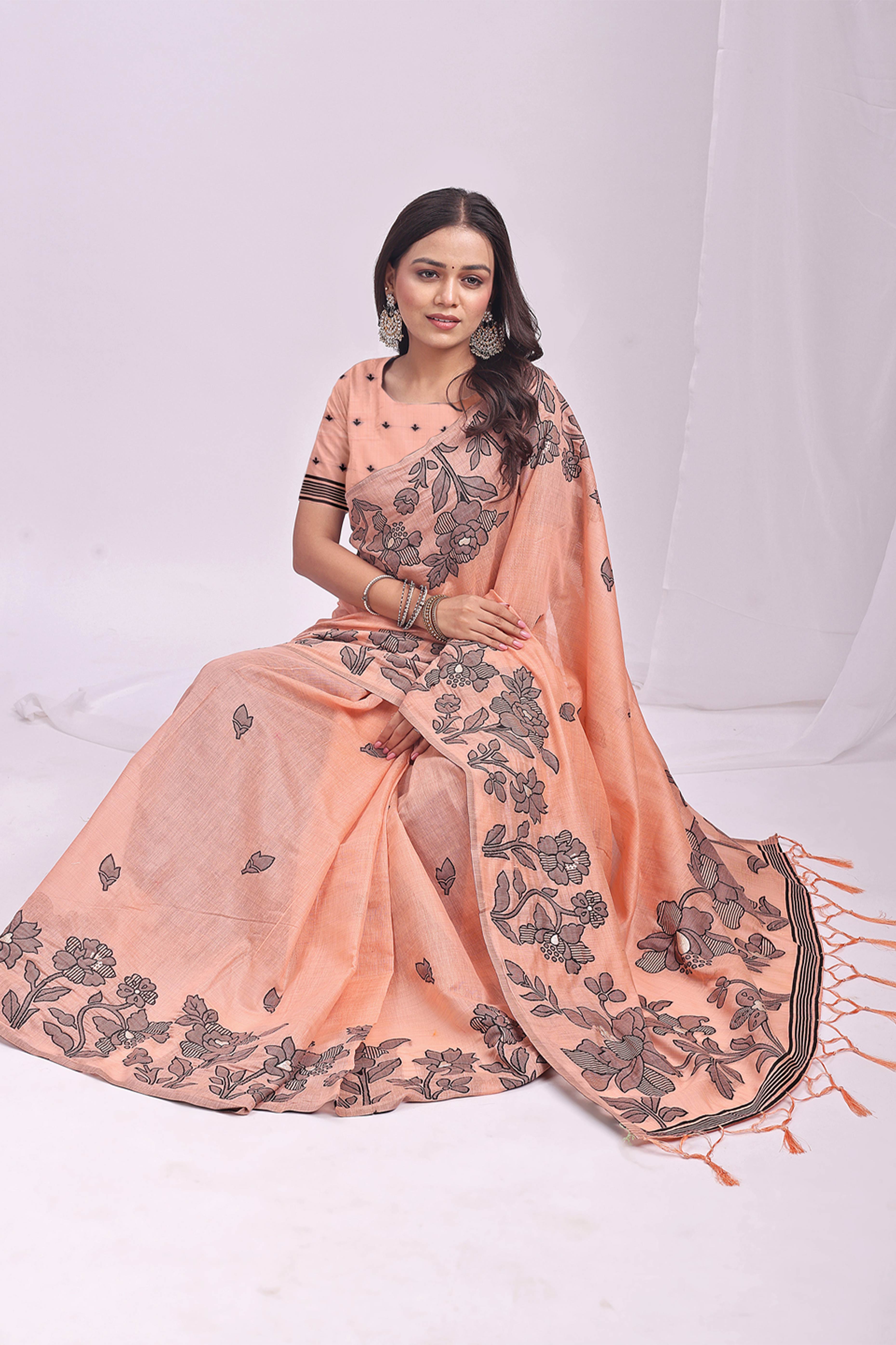 Orange Ethnic Saree in a Linen Cotton Blend Adorned with Floral Weave Designs