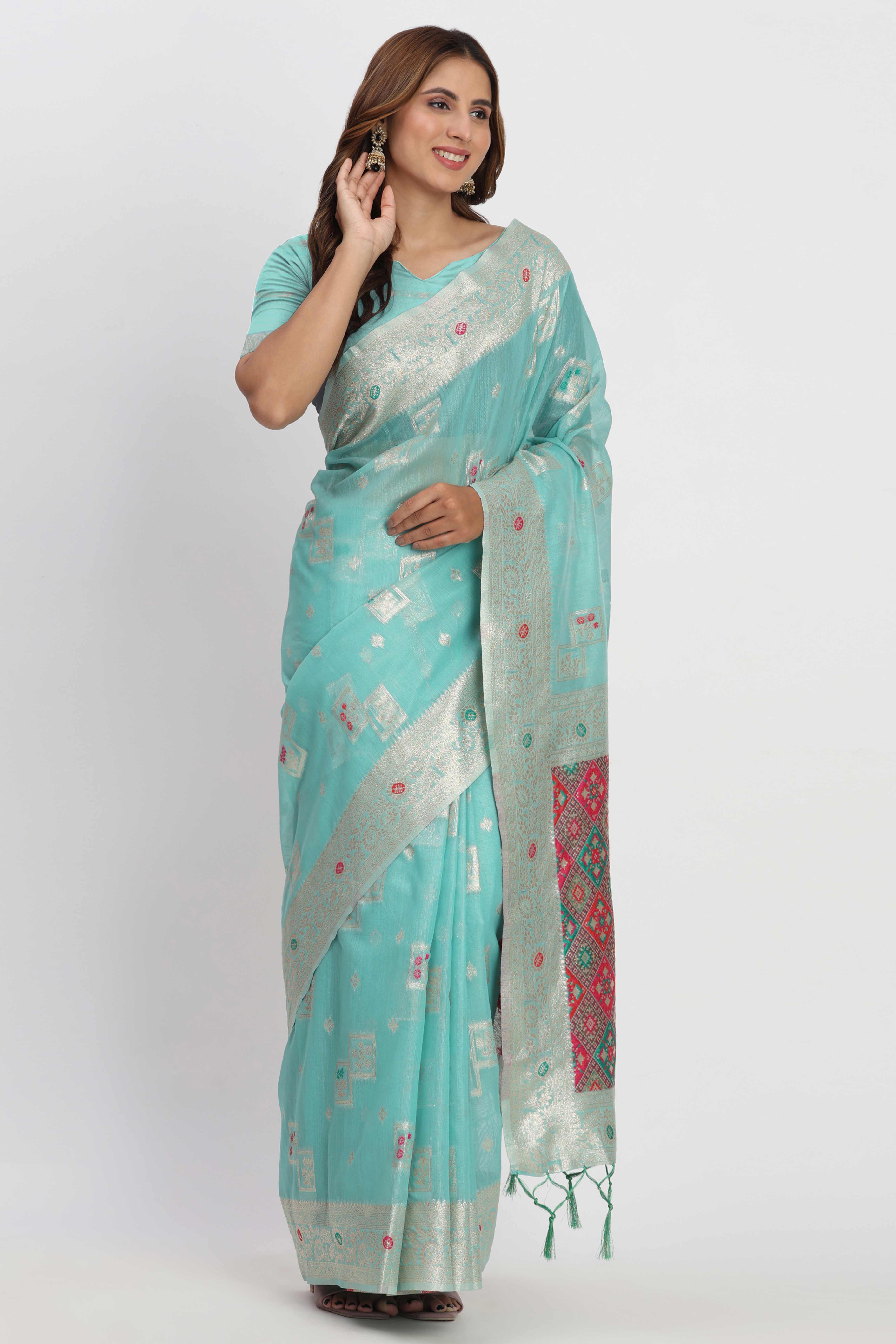 Floral Zari Weaving Brings Regal Beauty To This Turquoise Linen Cotton Saree With Tassel Accents