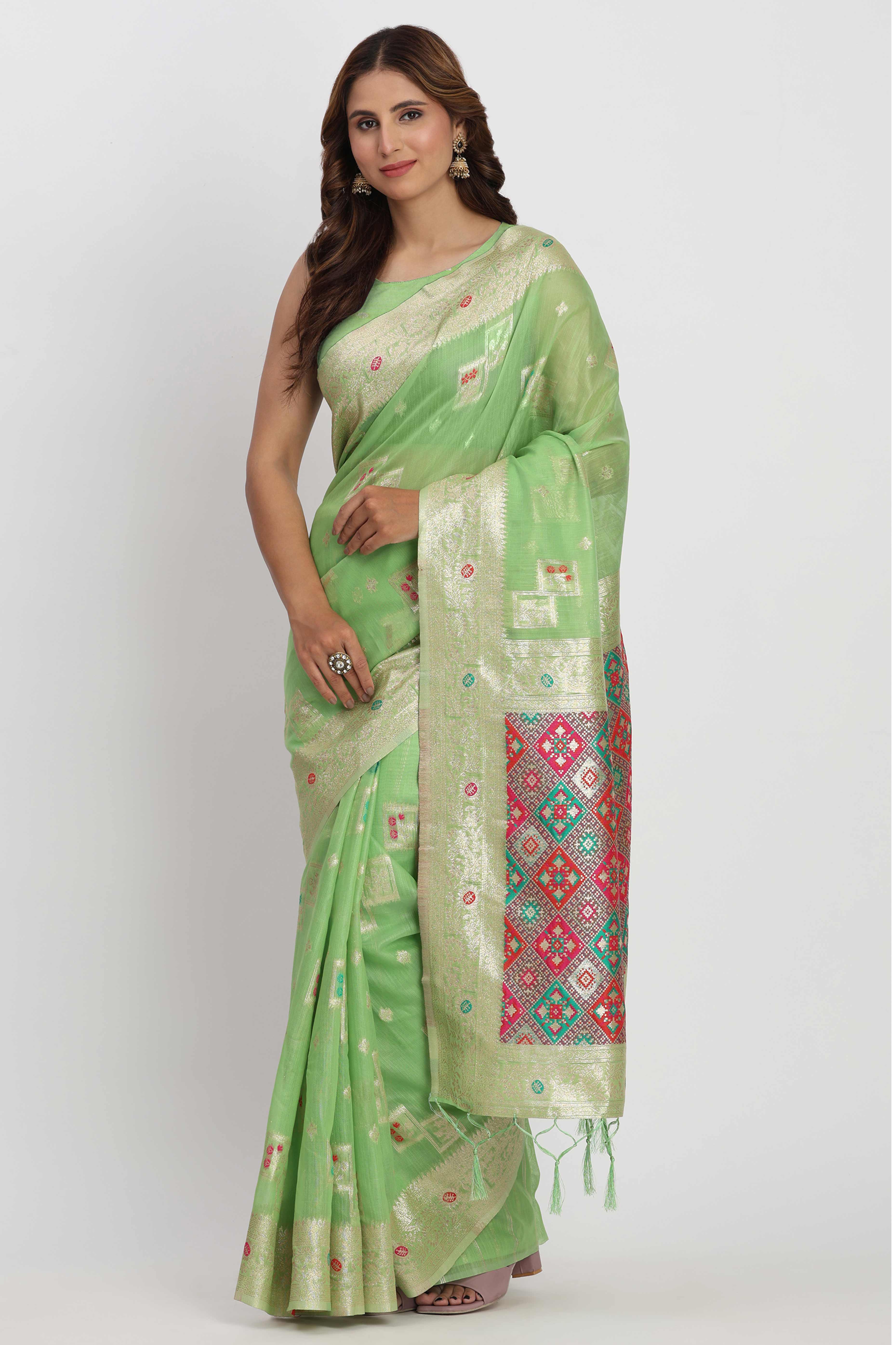 Floral Zari Weaving Brings Regal Beauty To This Light Green Linen Cotton Saree With Tassel Accents