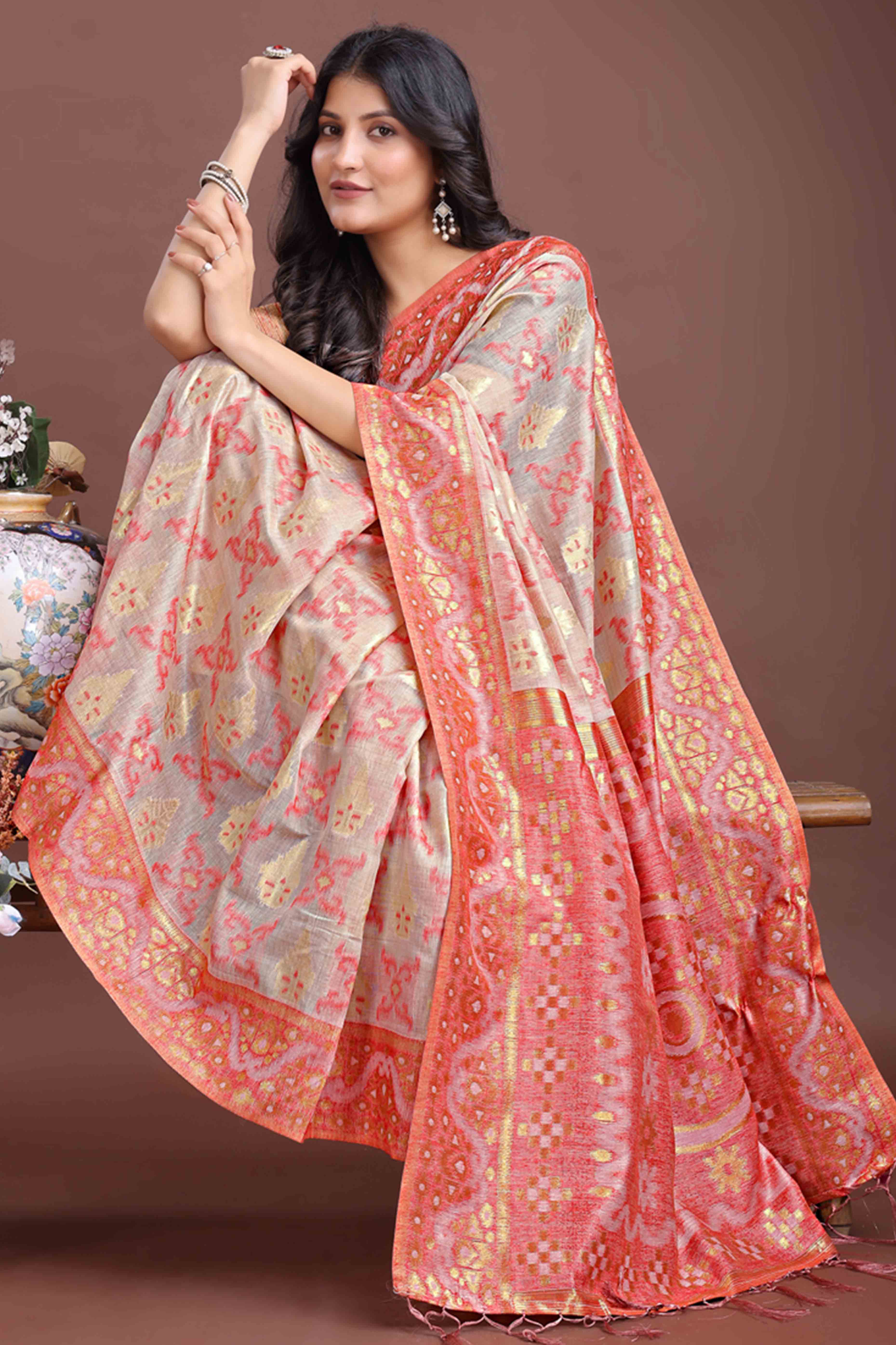 Exquisite Peach Traditional Ikkat Style Zari Weaving Cotton Blend Saree with Delicate Tassels