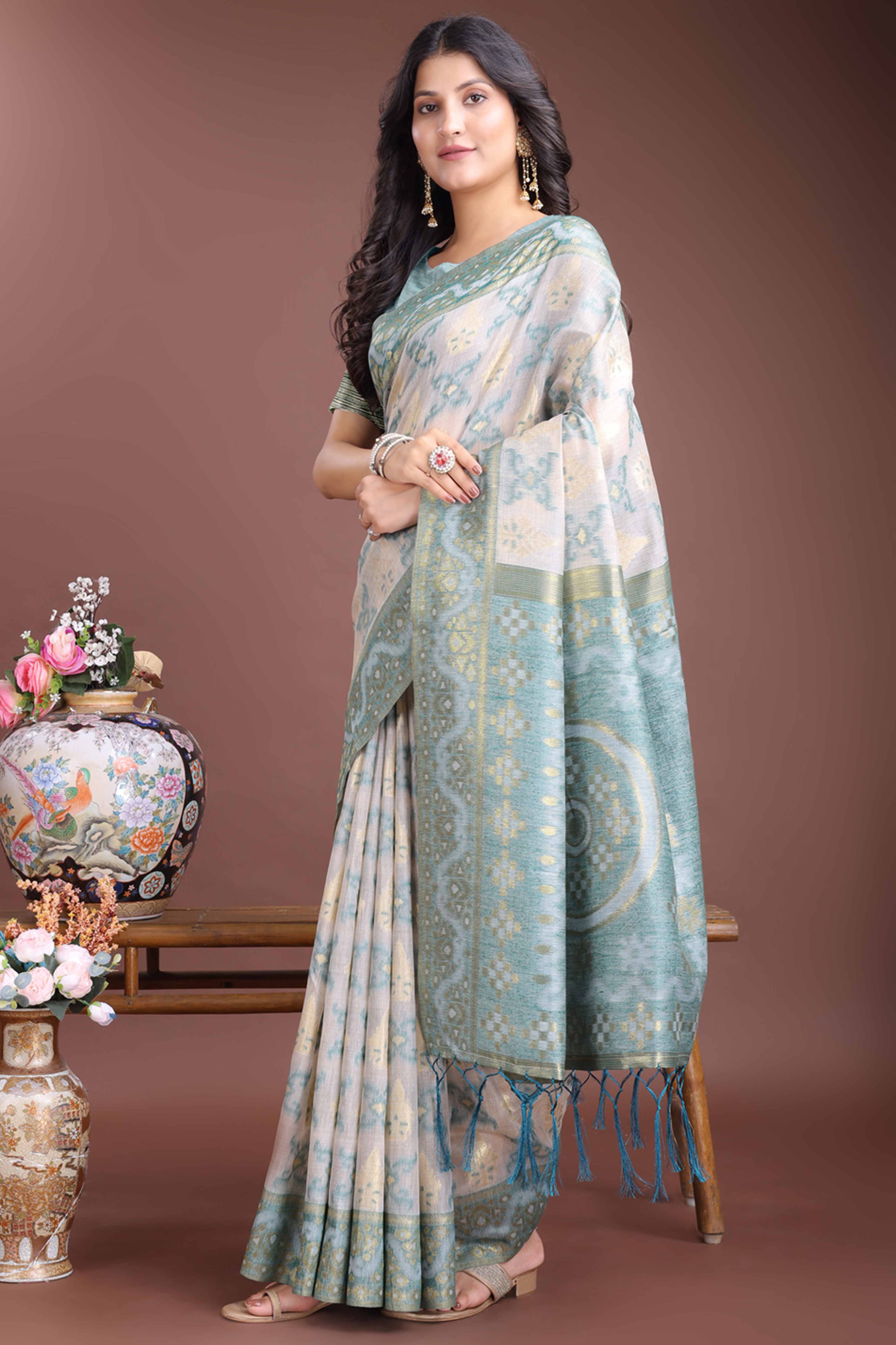 Serene Sea Green Traditional Ikkat Style Zari Weaving Cotton Blend Saree with Artistic Tassel Details