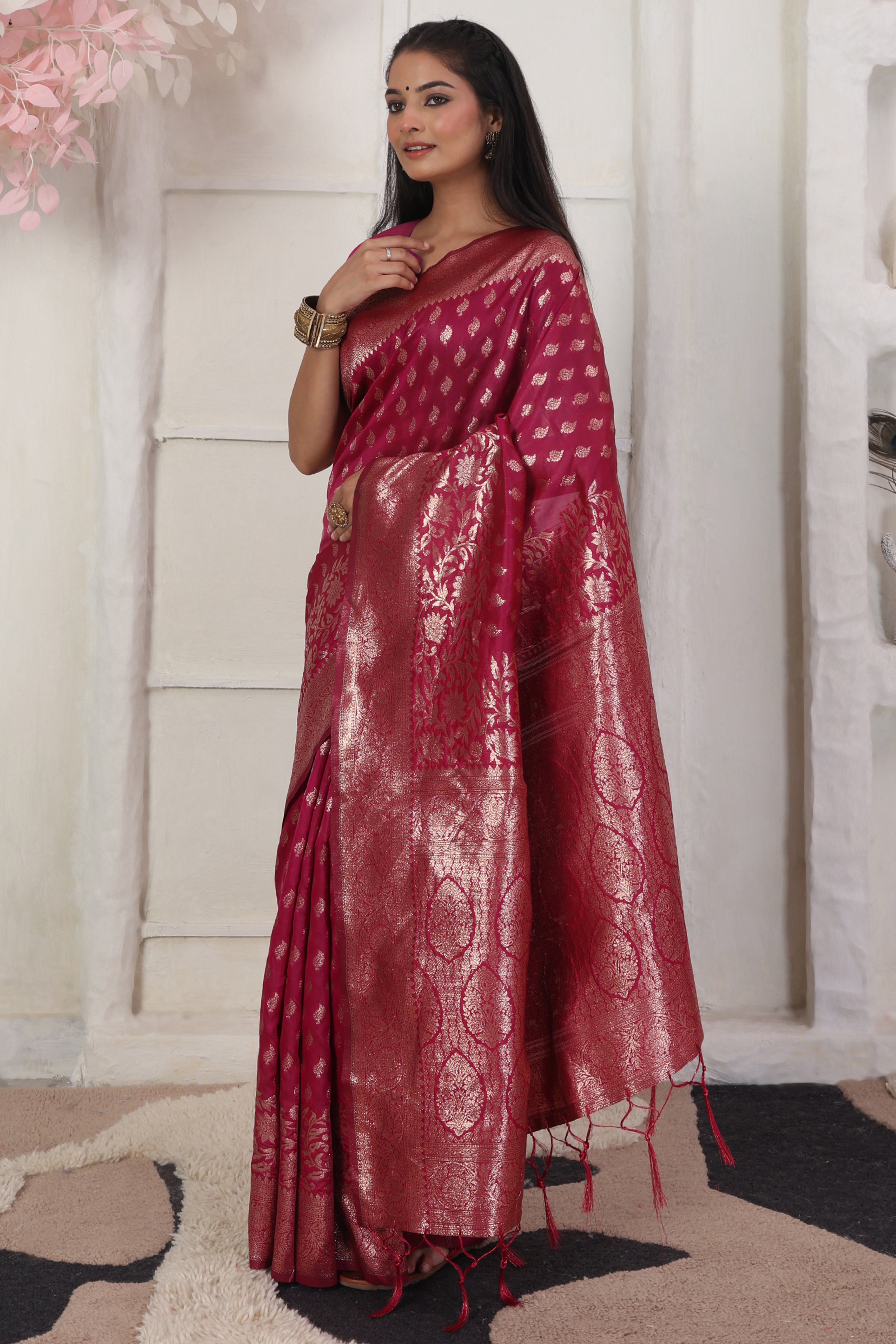 Pink Traditional Lichi Silk Blend Saree Enhanced With Floral Zari Weaving & Tassel Pallu