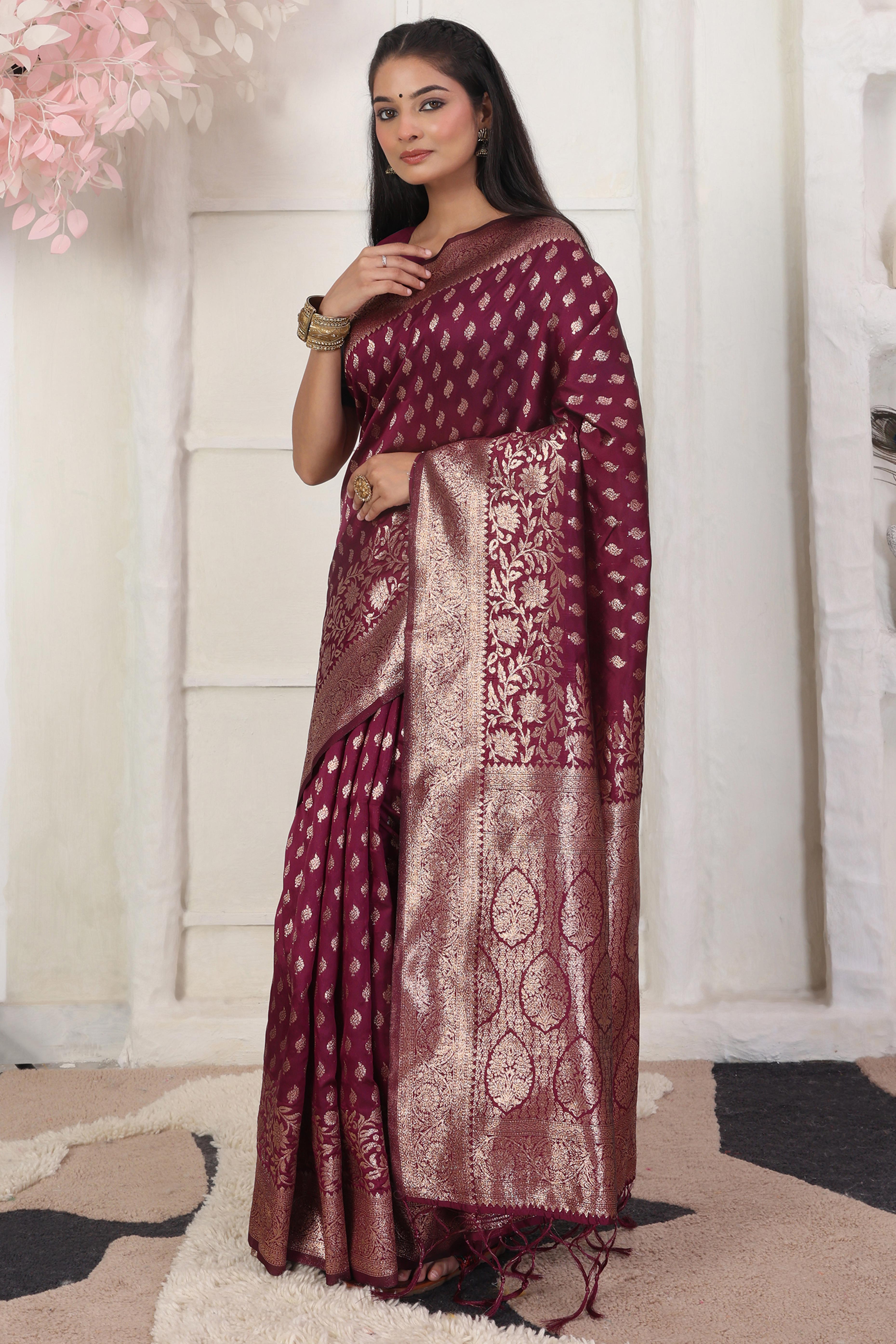Wine Traditional Lichi Silk Blend Saree Enhanced With Floral Zari Weaving & Tassel Pallu