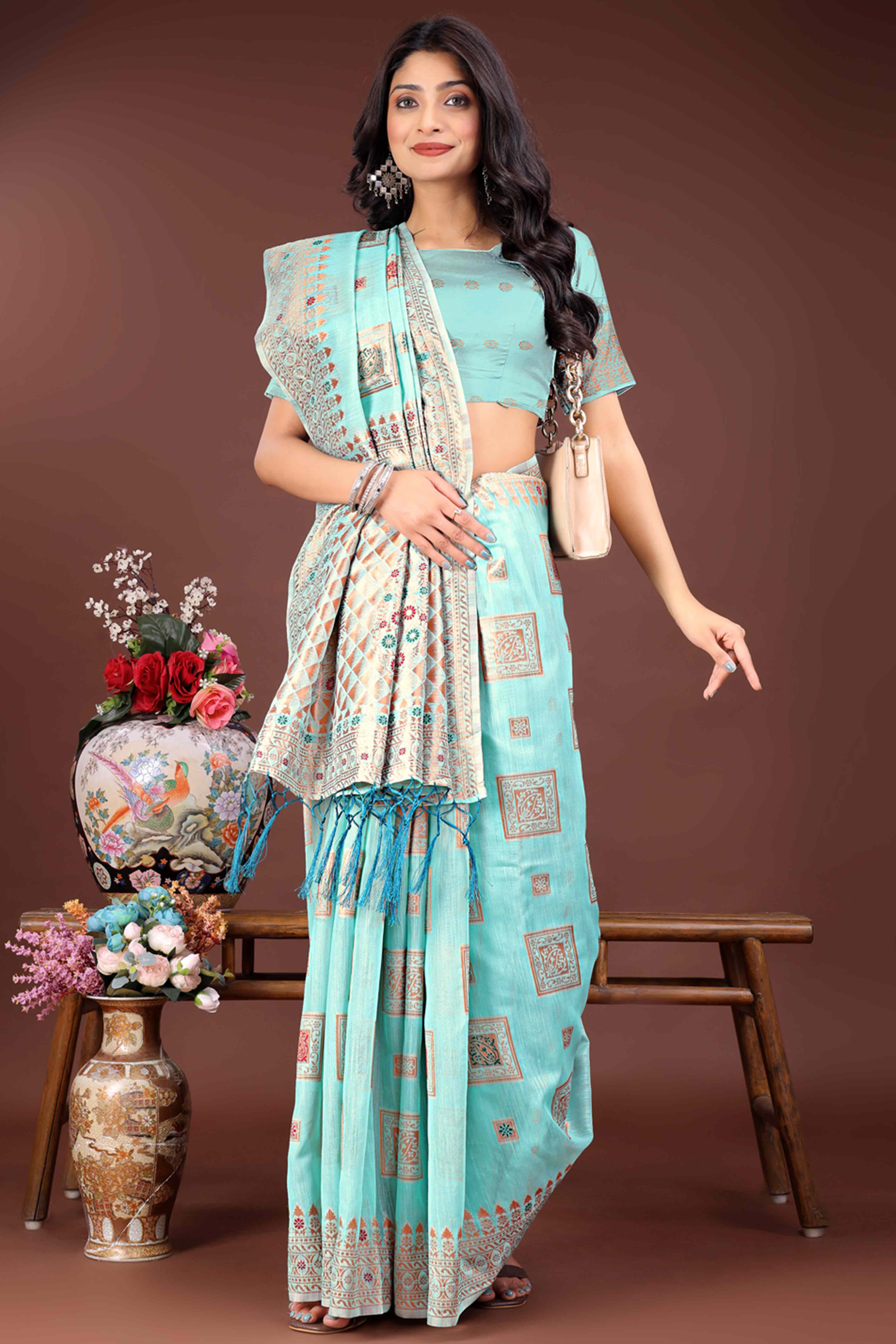 Majestic Floral Zari Weaving Embellished Pale Blue Saree In Linen Cotton with Tassel Accents