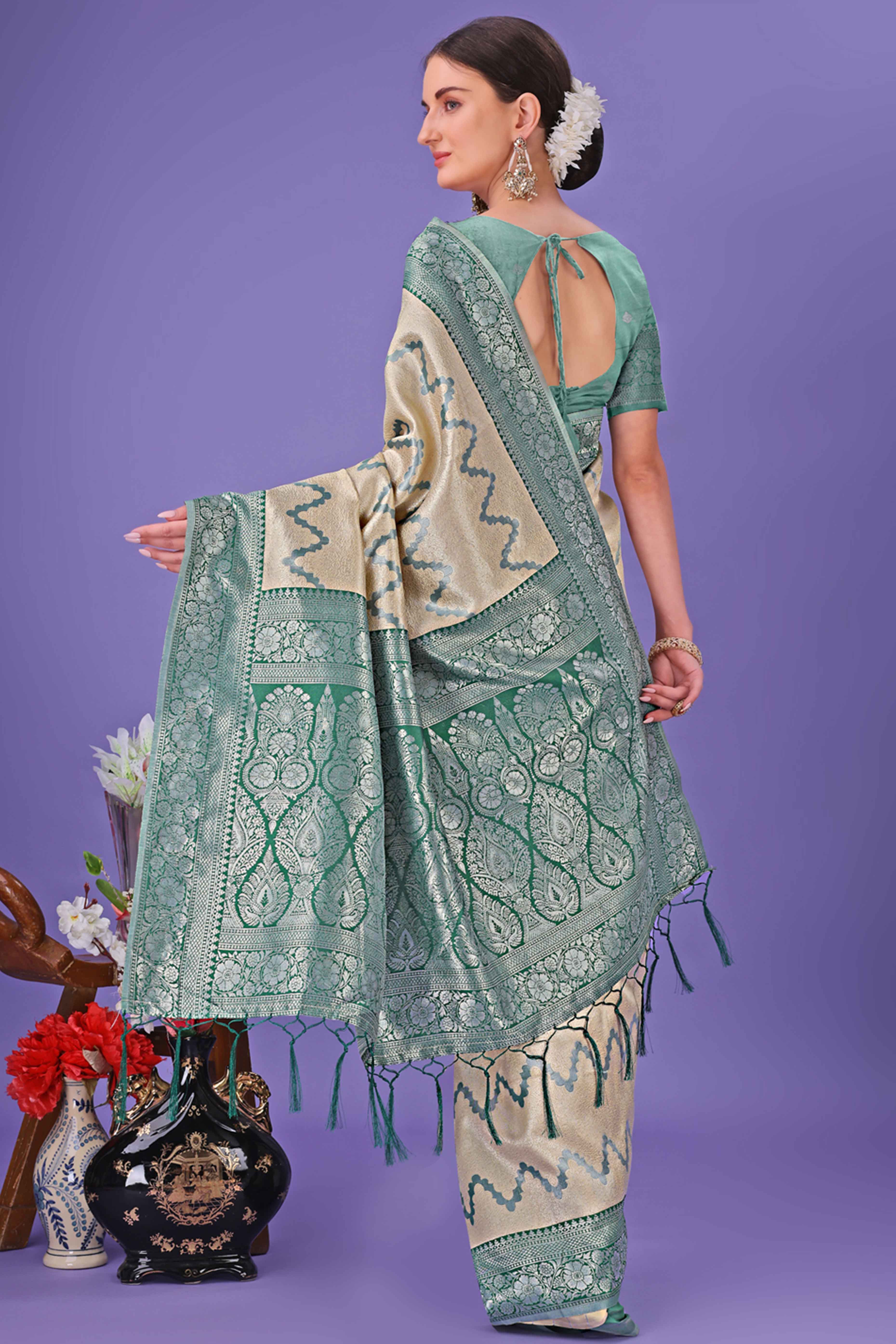 Cream Lichi Cotton Silk Saree Adorned With Floral Zari Weave & Tassels