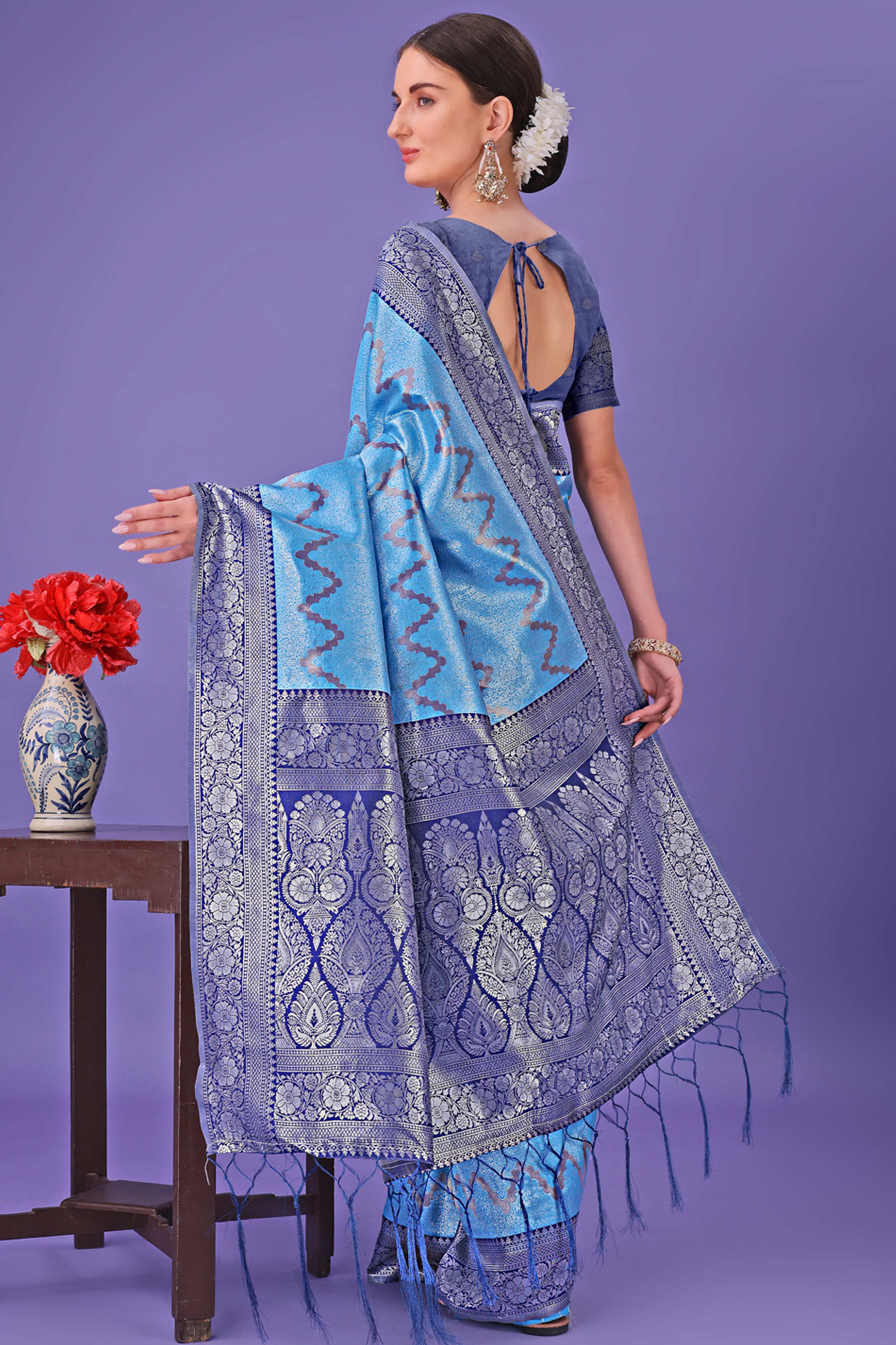 Blue Lichi Cotton Silk Saree Adorned With Floral Zari Weave & Tassels