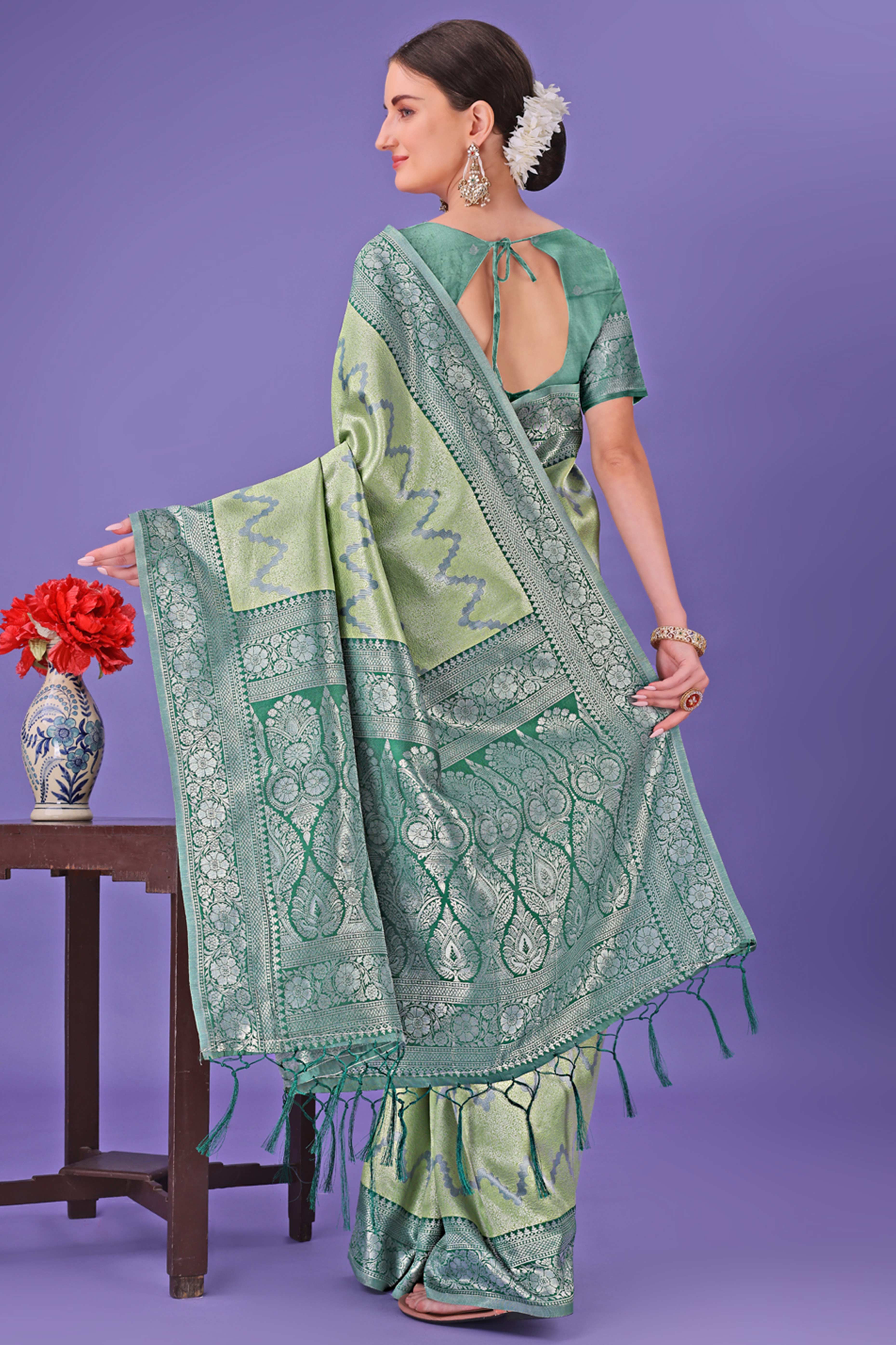 Light Green Lichi Cotton Silk Saree Adorned With Floral Zari Weave & Tassels
