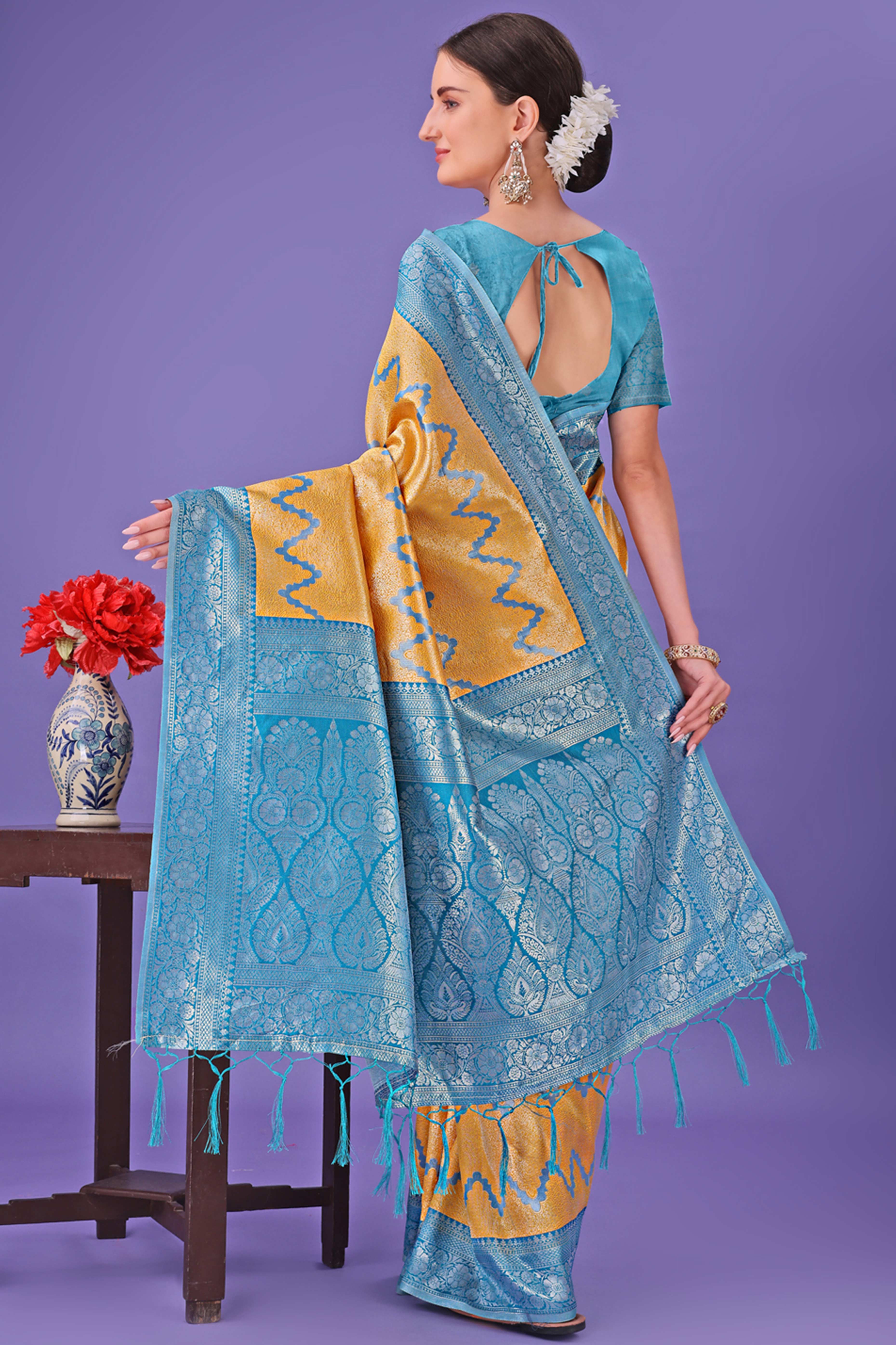 Yellow Lichi Cotton Silk Saree Adorned With Floral Zari Weave & Tassels