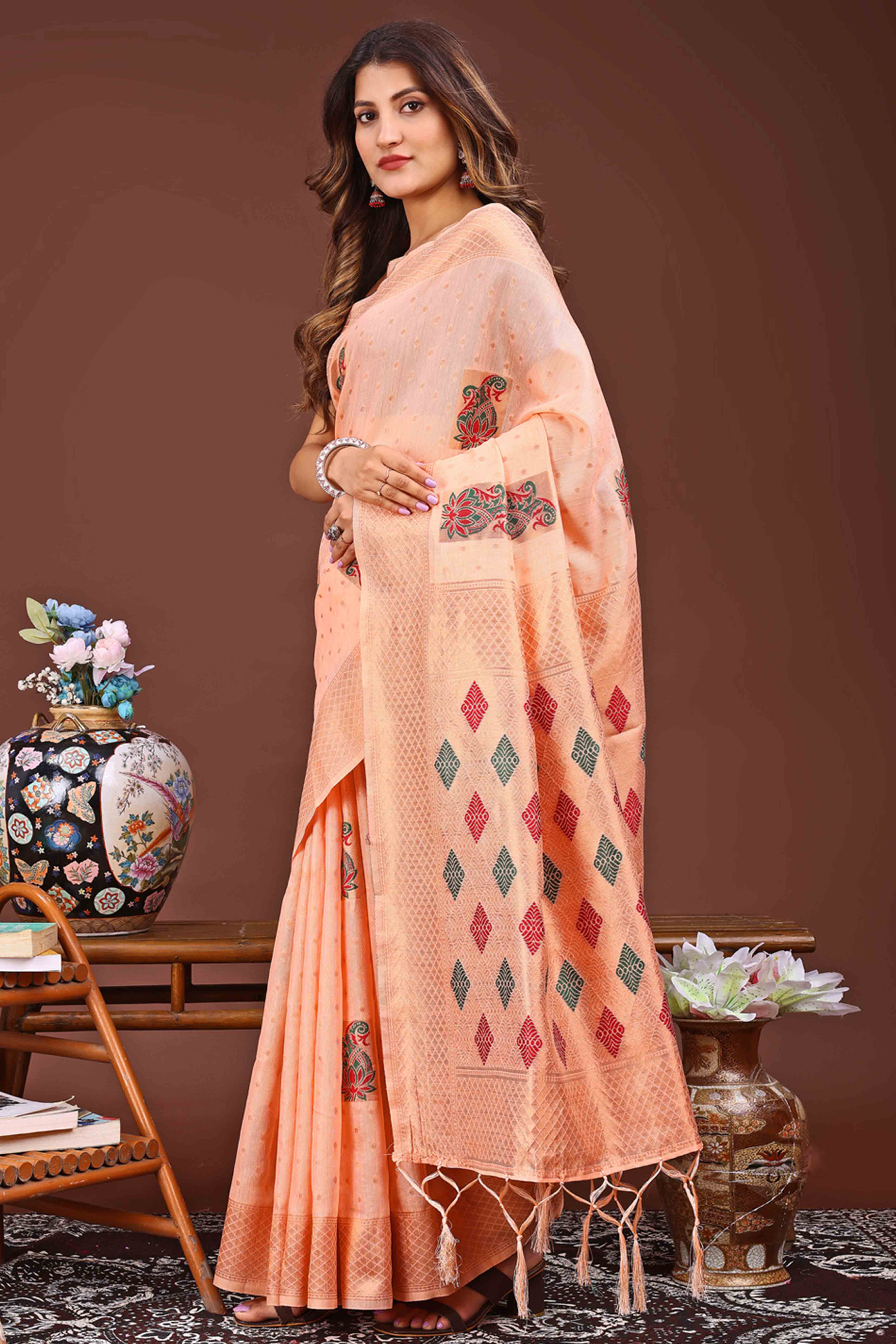Light Orange Floral Zari Weaving Linen Cotton Saree With Tassel Pallu Accent