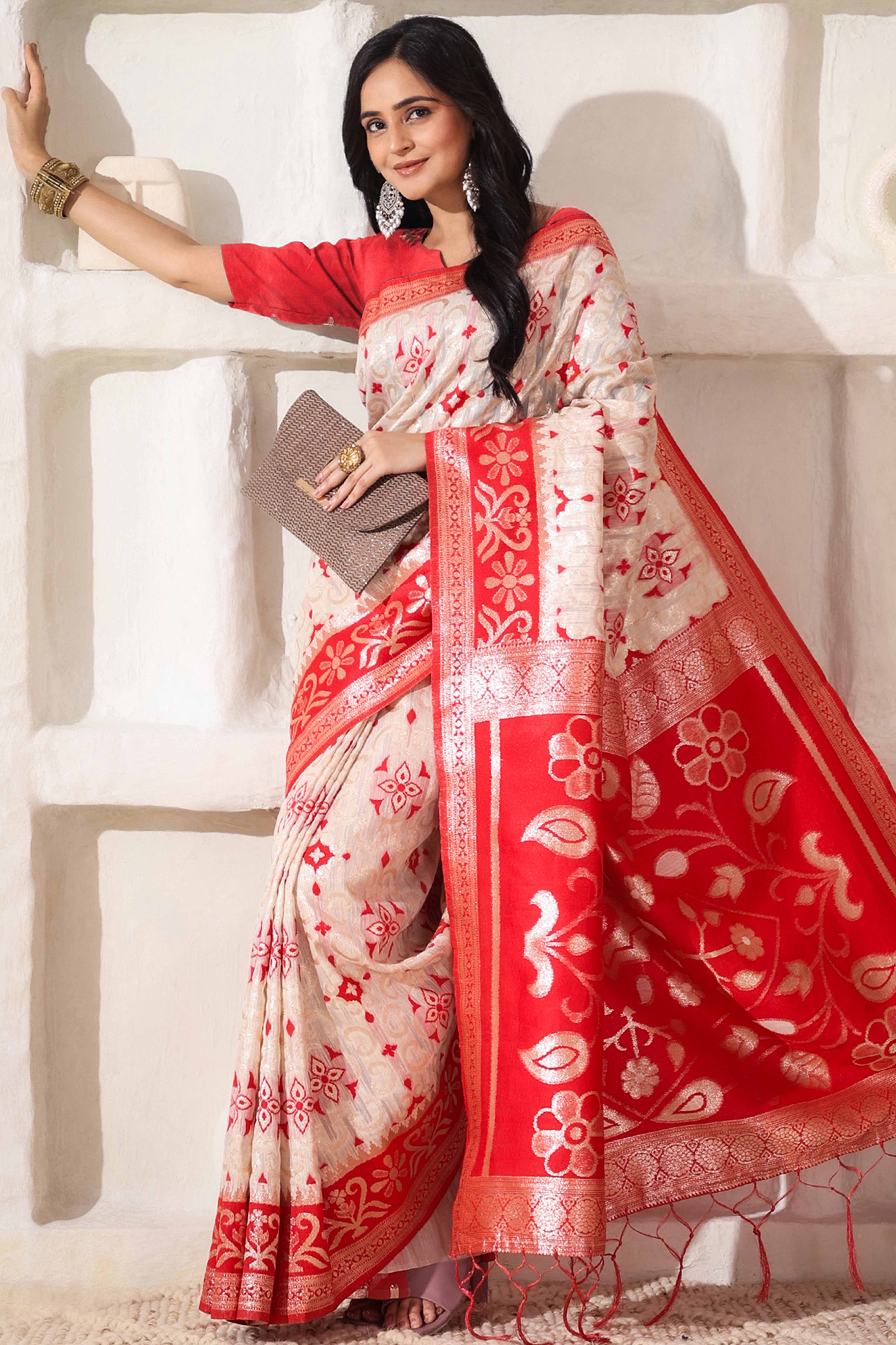 White & Red Linen Cotton Saree Adorned With Intricate Zari Weaving And Tassel Pallu