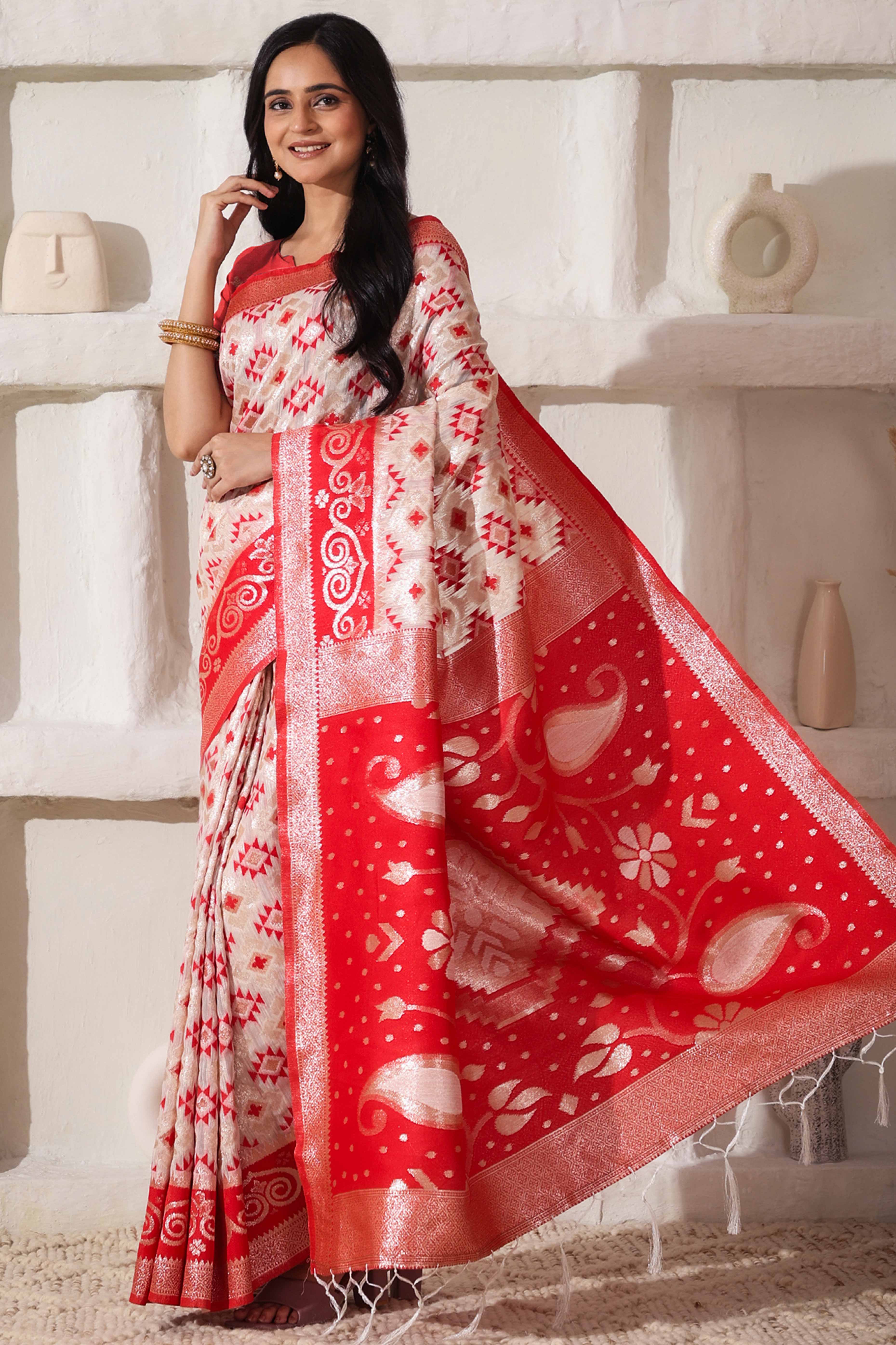 White & Red Linen Cotton Saree Featuring Fine Zari Weaving And A Tasselled Finish