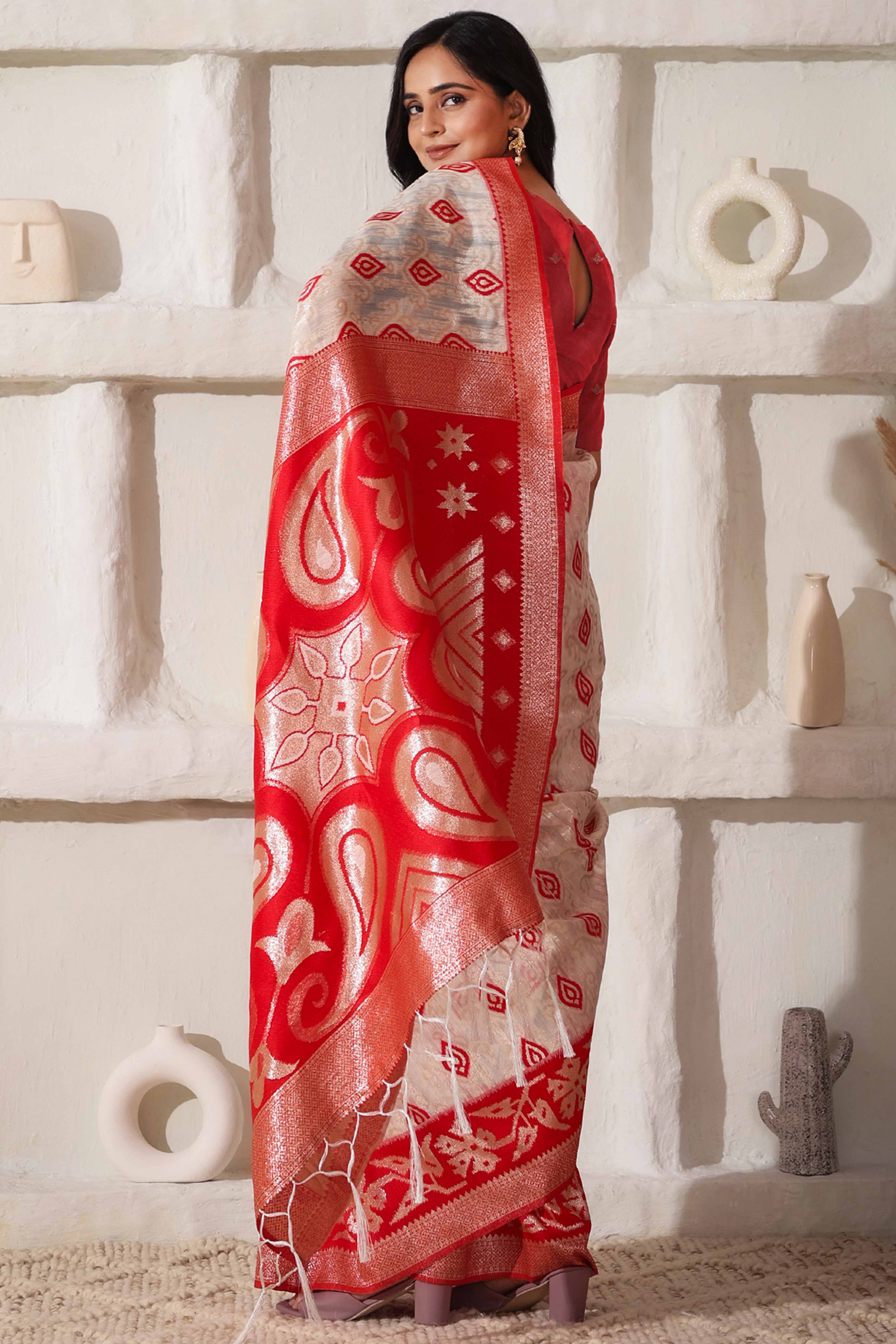 Classic White & Red Saree In Linen Cotton With Rich Zari Weaving And Tassel Accents