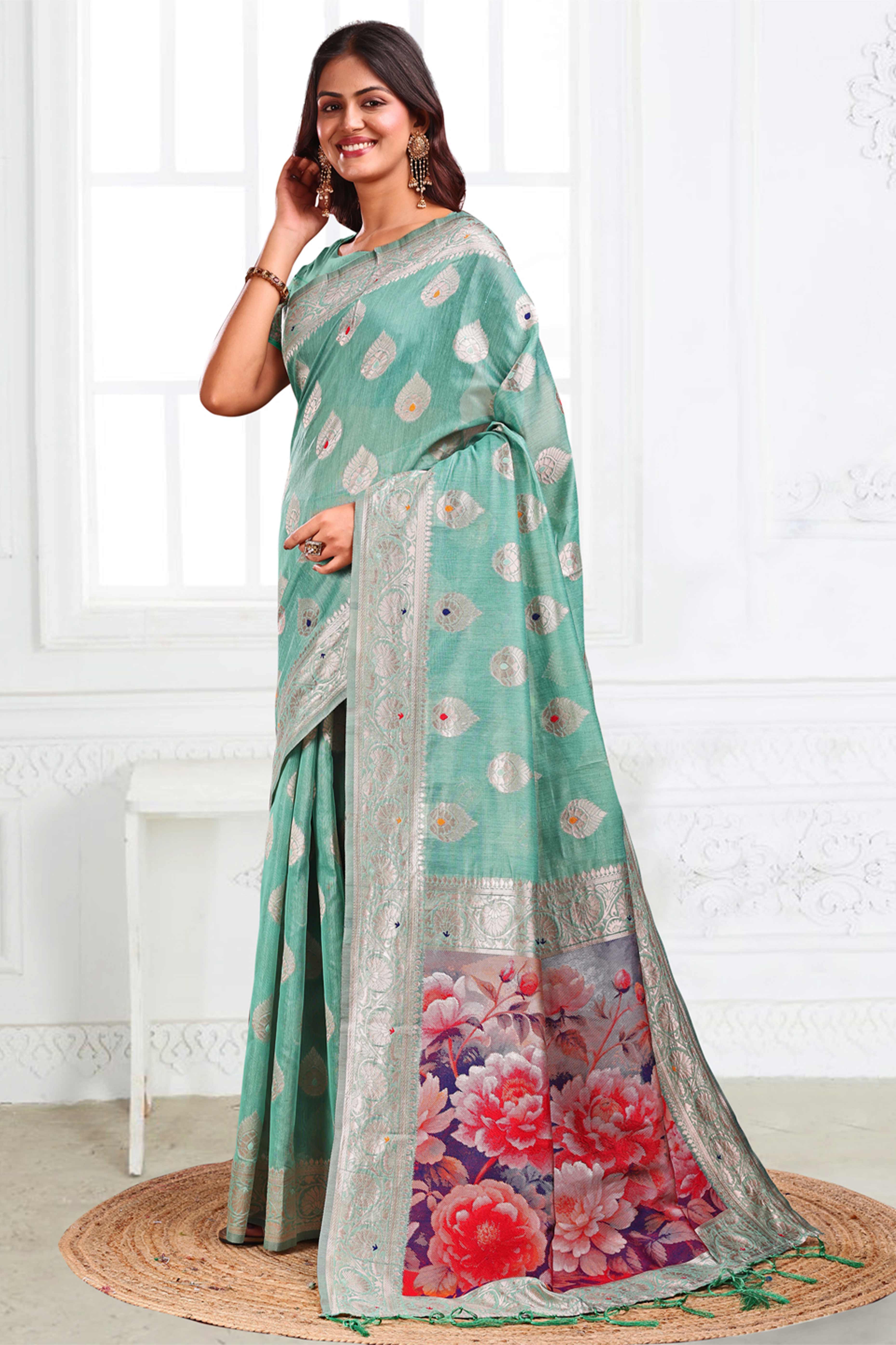Turquoise Linen Cotton Silk Saree Adorned With Intricate Floral Zari Weaving & Tassel Pallu