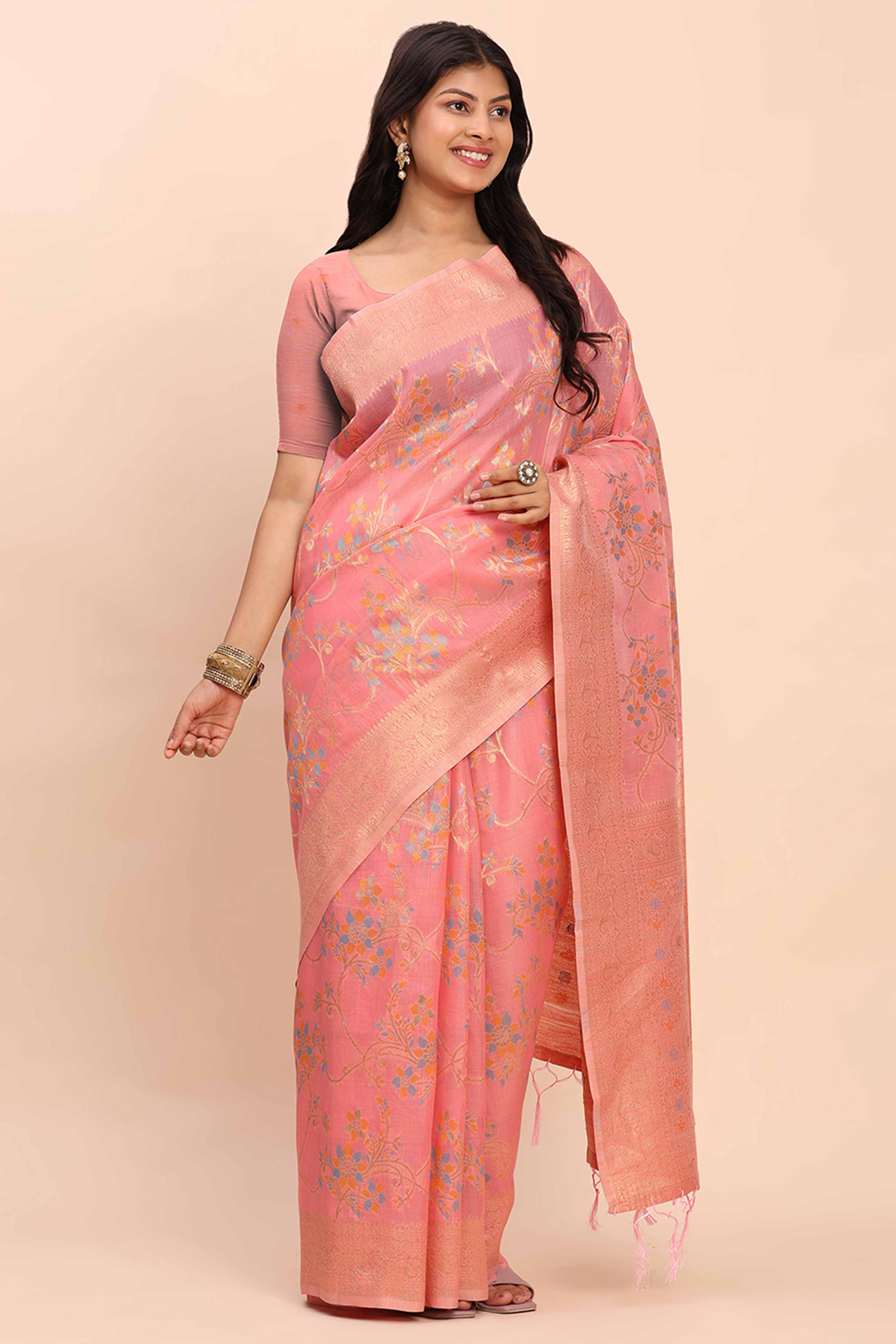 Salmon Pink Linen Cotton Saree Showcasing Floral Zari Weaves & A Tasselled Finish Pallu