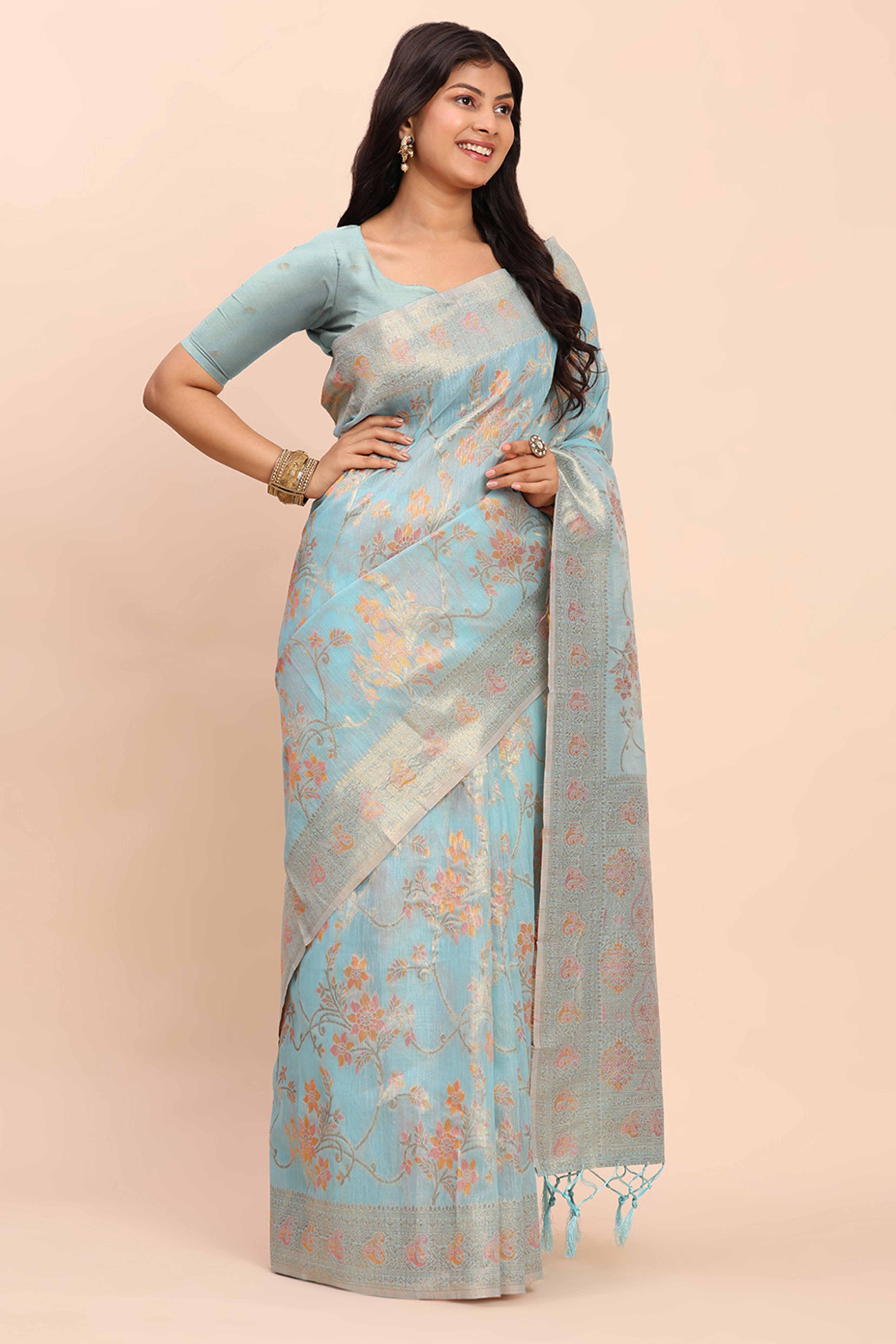 Sky Blue Linen Cotton Saree Showcasing Floral Zari Weaves & A Tasselled Finish Pallu