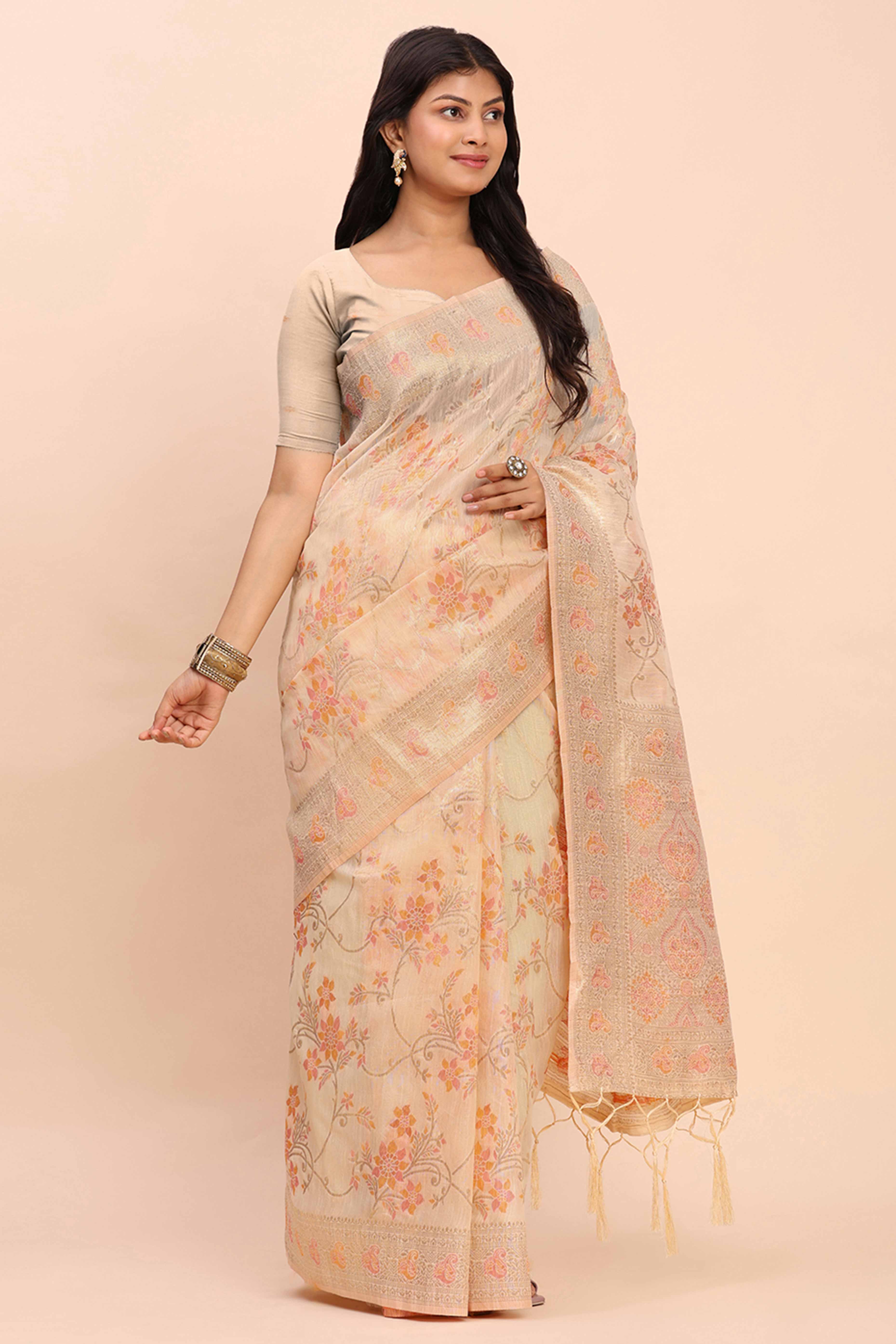 Cream Linen Cotton Saree Showcasing Floral Zari Weaves & A Tasselled Finish Pallu