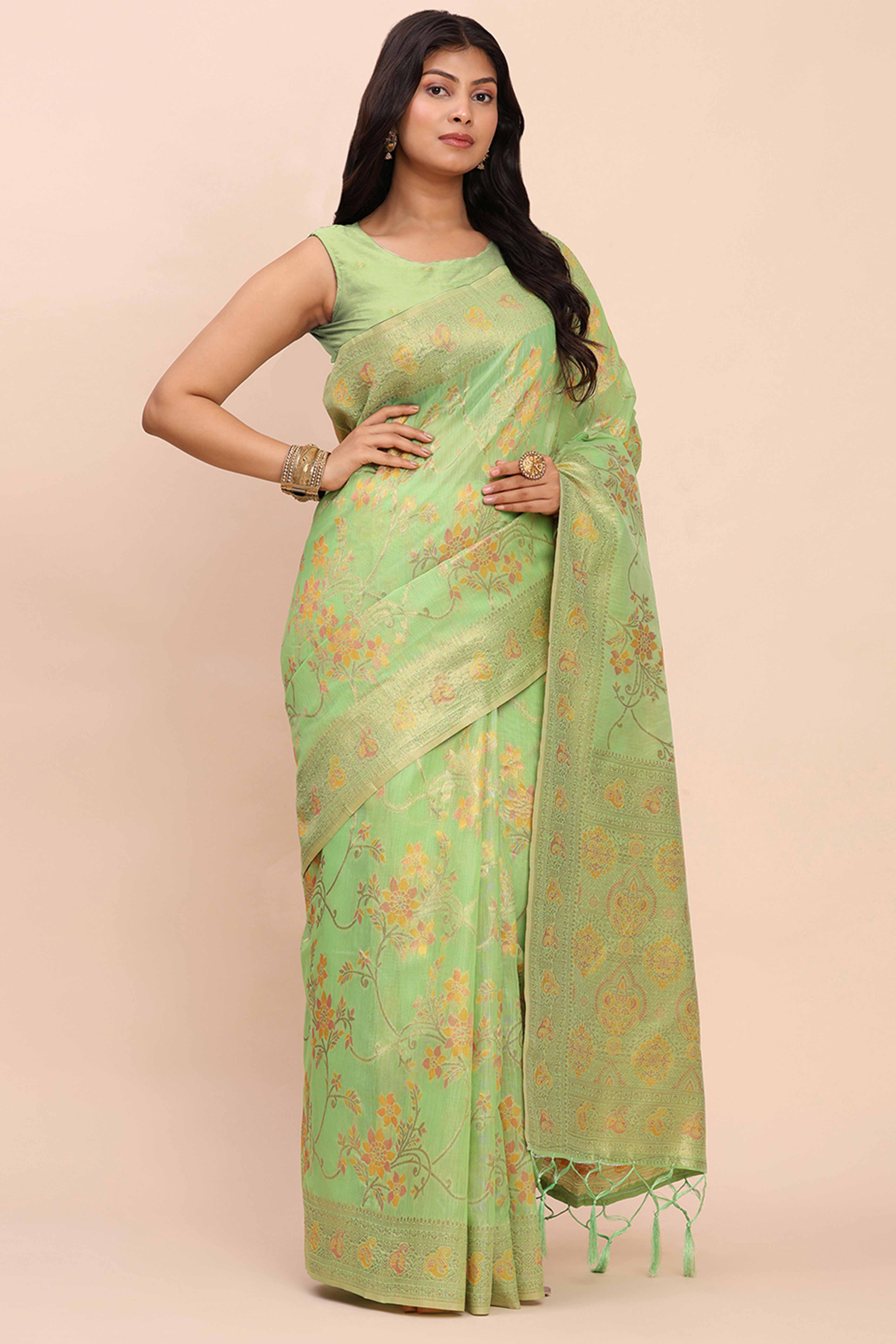 Green Linen Cotton Saree Showcasing Floral Zari Weaves & A Tasselled Finish Pallu