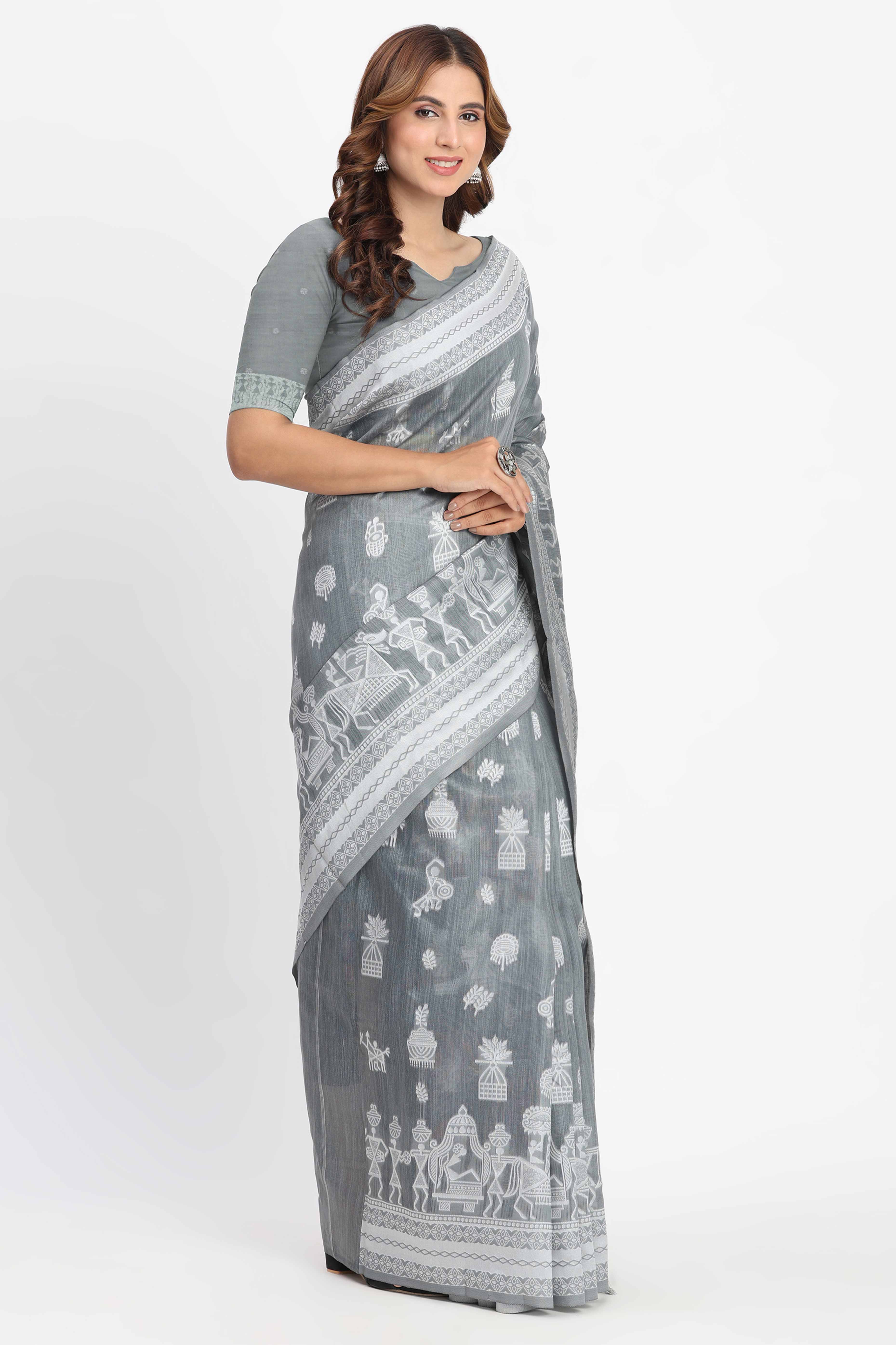 Grey Linen Cotton Saree Showcasing Traditional Warli Motifs In Zari Weaving With Tassel Pallu