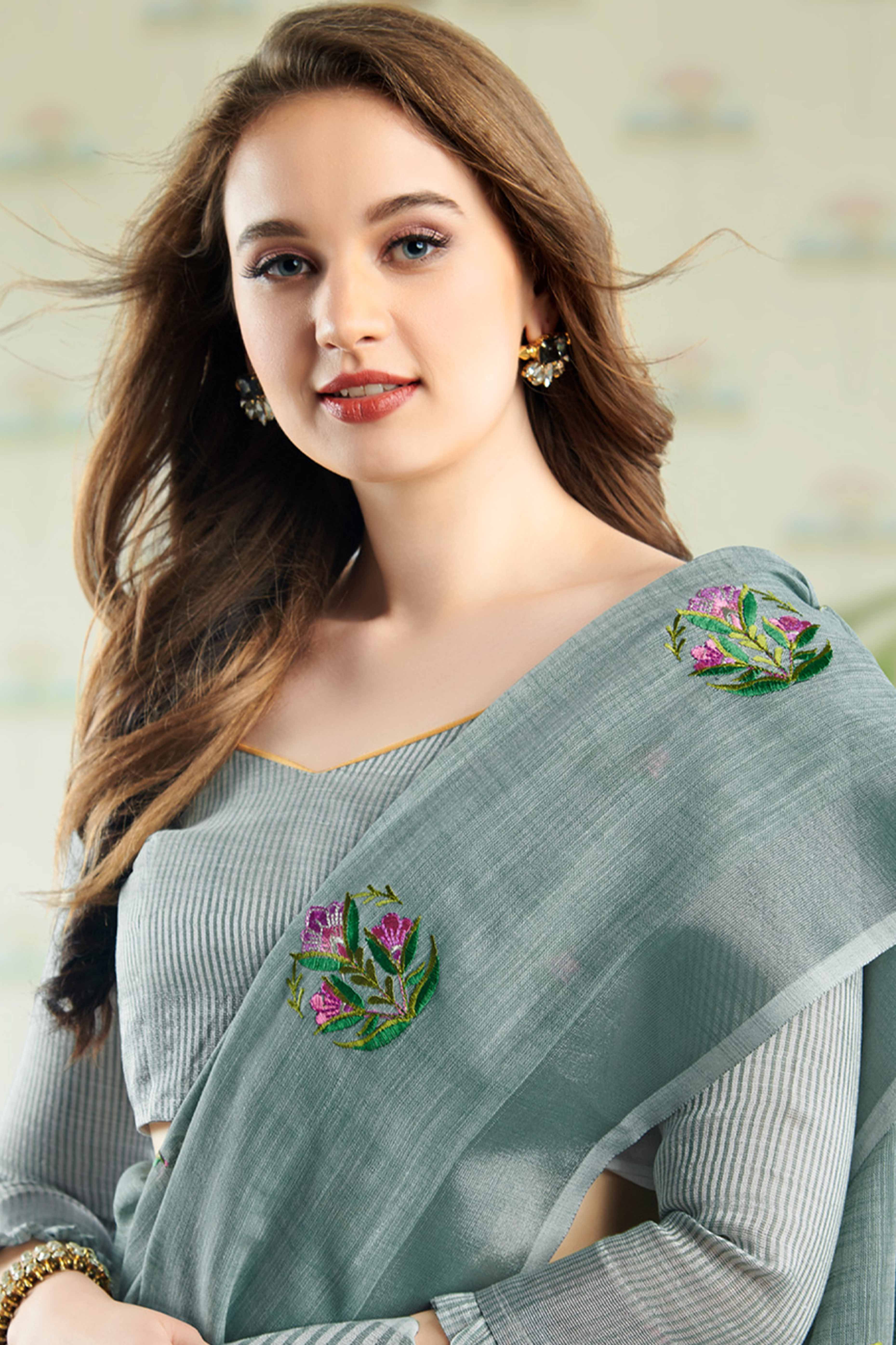 Sea Green Linen Saree with Intricate Floral Embroidery and Classic Weaving